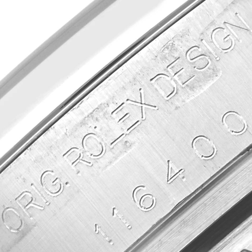 The image shows the engraved side of the Rolex Milgauss 116400 Men
s Stainless Steel Black Dial 116400 Men
s Stainless Steel Black Dial watch, featuring the serial number and "Rolex Design" text.