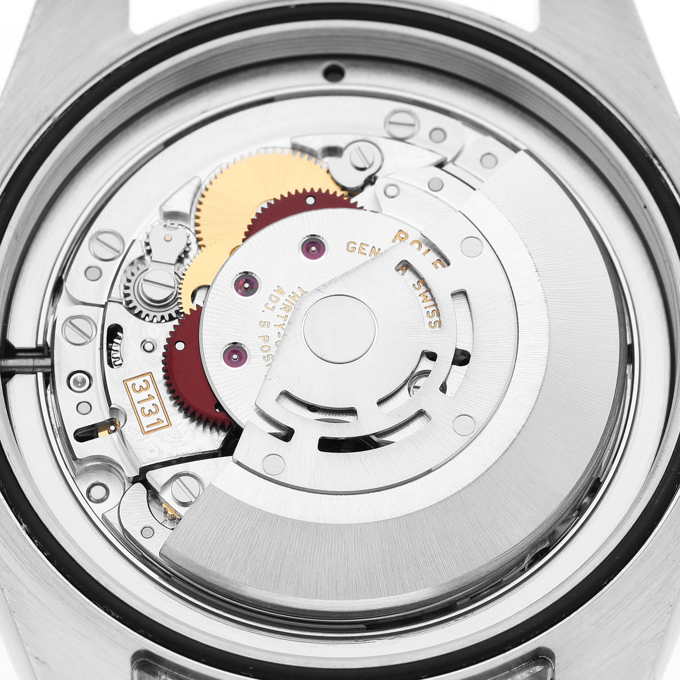 The image shows the internal movement mechanism of a Rolex Milgauss 116400GV Men's Stainless Steel Blue Dial, highlighting gears and a rotor from a top-down angle.
