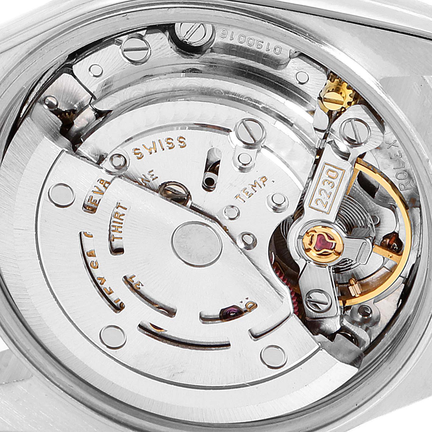 The image shows an internal view of the Rolex Oyster Perpetual 76080 Women's Stainless Steel Pink Dial 76080 Women's Stainless Steel Pink Dial watch, focusing on its intricate movement mechanism.