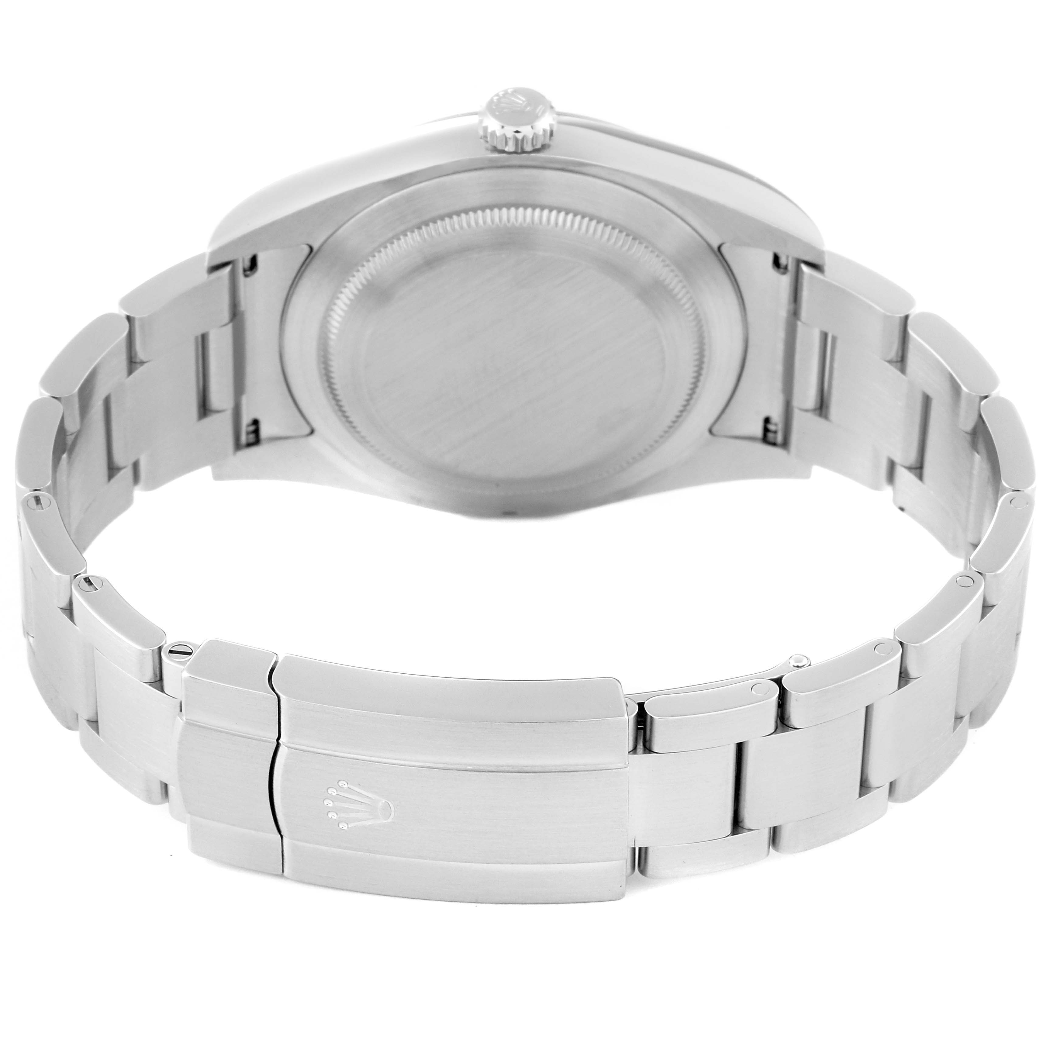 The image shows the back view of a Rolex Oyster Perpetual 114300 Men
s Stainless Steel Blue Dial 114300 Men
s Stainless Steel Blue Dial watch, featuring its closed stainless steel bracelet and clasp.