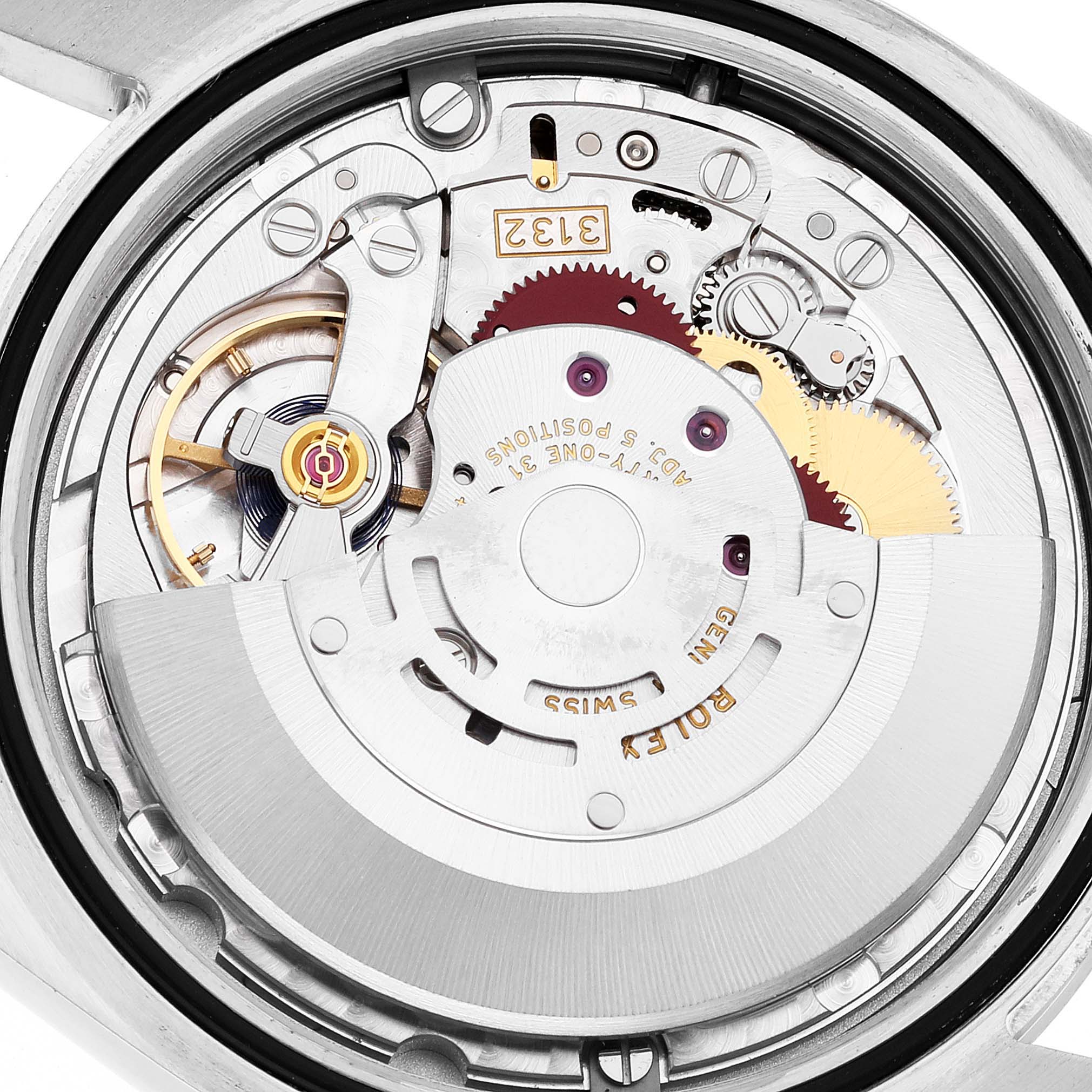 The image shows the internal mechanism of a Rolex Oyster Perpetual 114300 Men
s Stainless Steel Blue Dial 114300 Men
s Stainless Steel Blue Dial watch from a rear angle view.