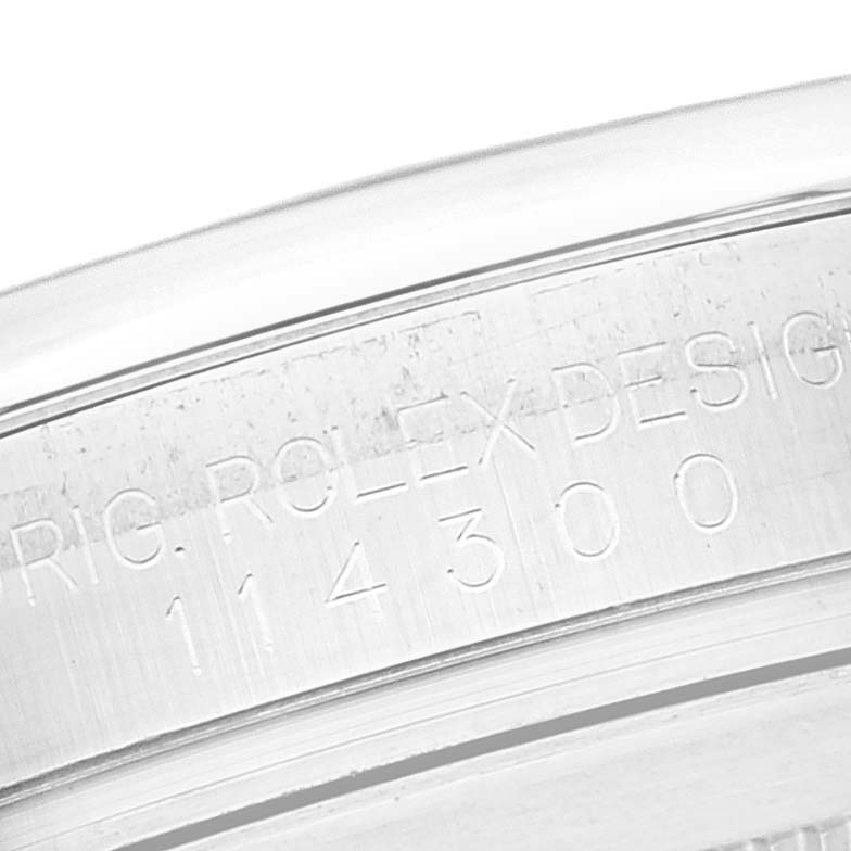 This image shows a close-up of the inner rim of a Rolex Oyster Perpetual 114300 Men
s Stainless Steel Blue Dial 114300 Men
s Stainless Steel Blue Dial watch, displaying the model number 114300.