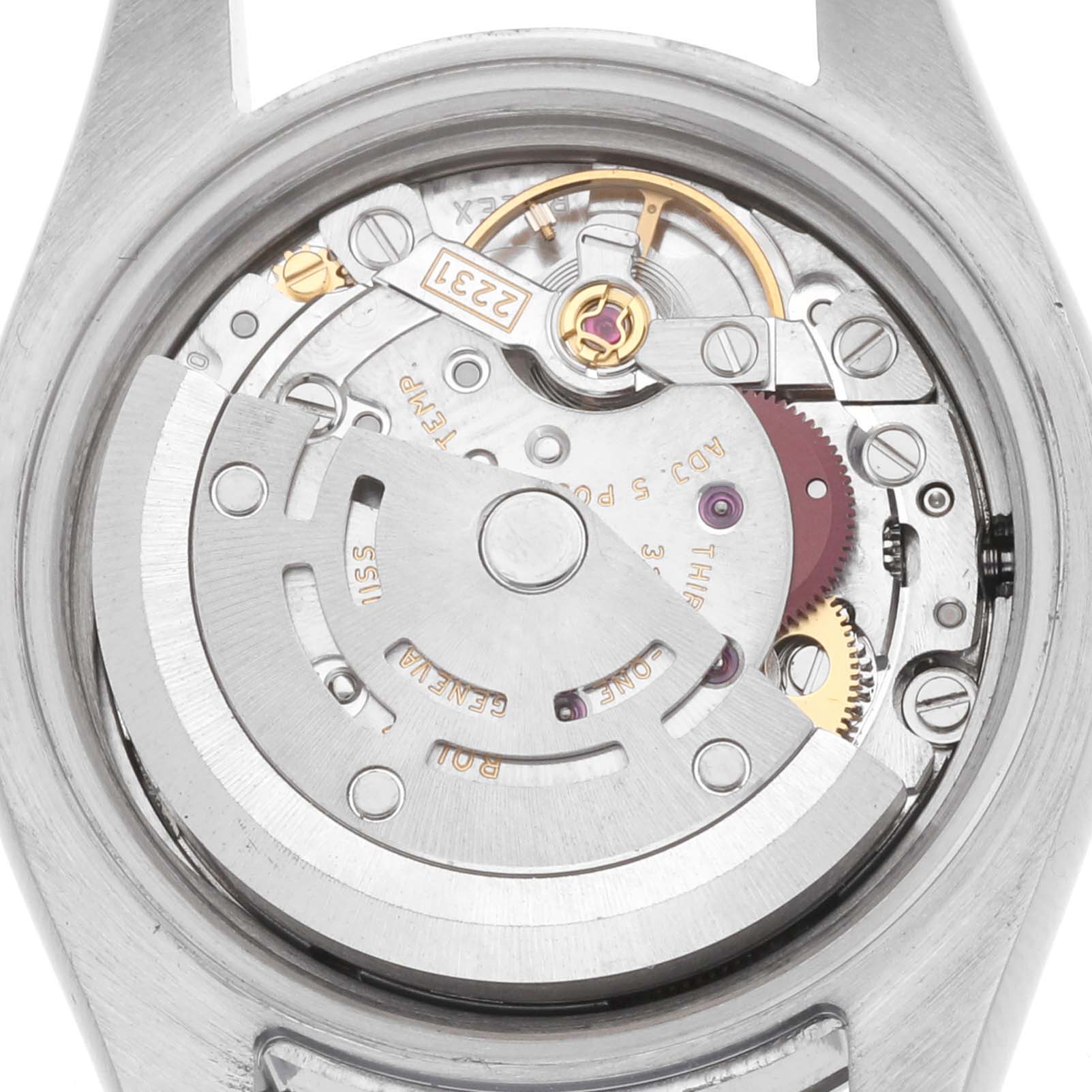 The image shows the movement mechanism of a Rolex Oyster Perpetual 176234 Women
s Stainless Steel Silver Dial from a rear angle, highlighting gears and the rotor.