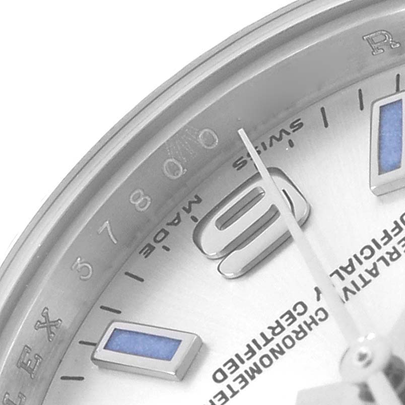 The image shows a close-up of the dial and bezel of a Rolex Oyster Perpetual 176234 Women
s Stainless Steel Silver Dial, highlighting the numbers, markers, and text.