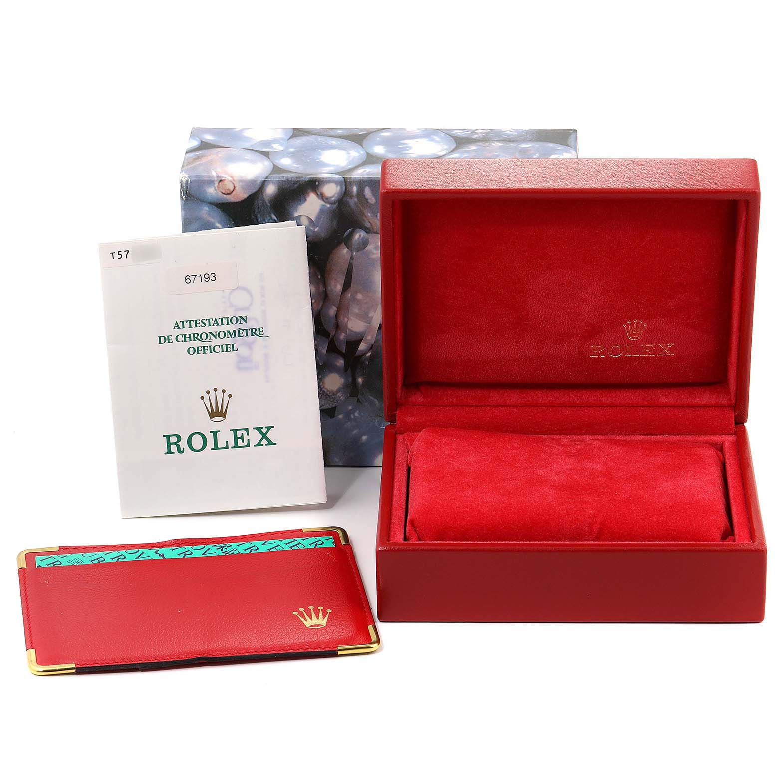 This image shows a Rolex Oyster Perpetual 67193 Women
s Steel and Gold (two tone) Champagne Dial 67193 Women
s Steel and Gold (two tone) Champagne Dial watch box, warranty card holder, and chronometer certificate documentation.