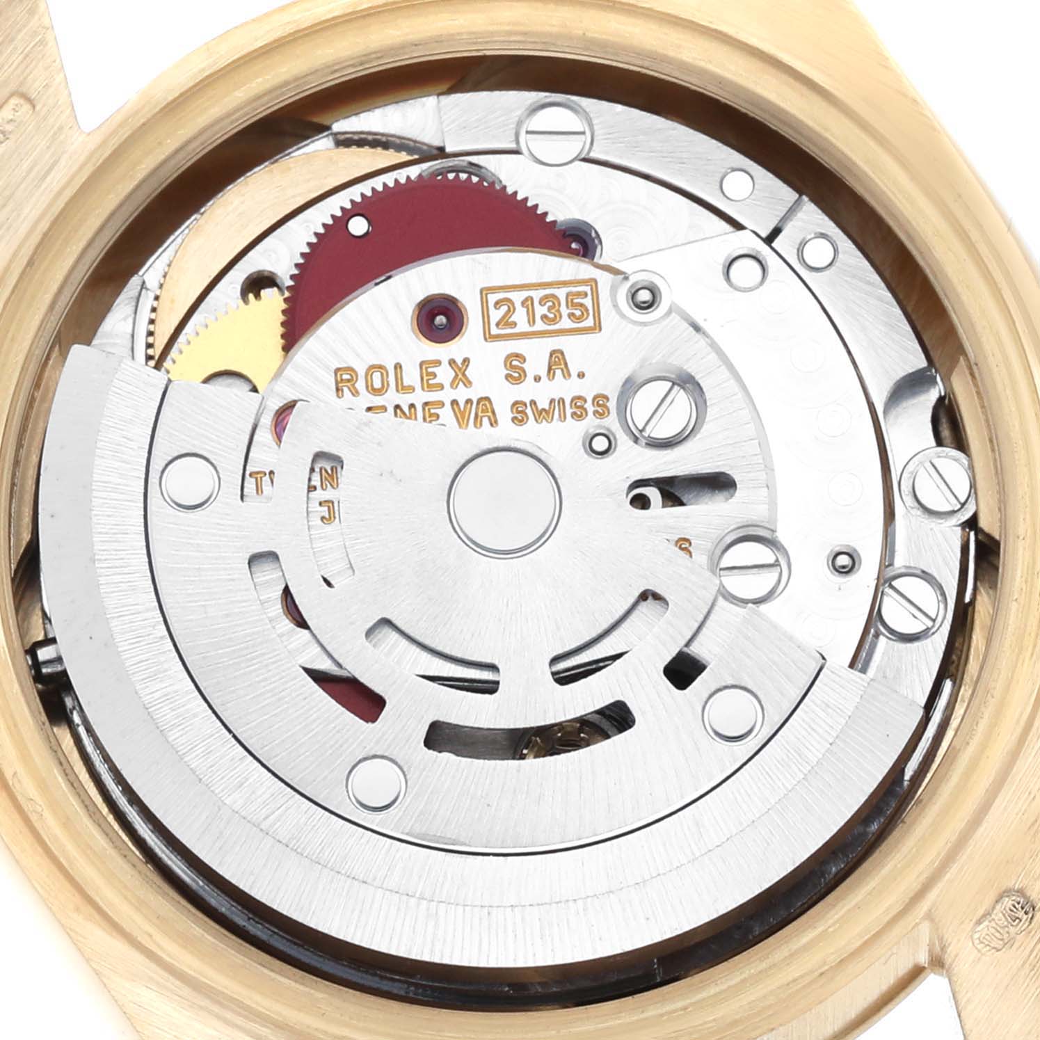The image shows the movement mechanism of the Rolex President 69178 Women's Yellow Gold Champagne Dial 69178 Women's Yellow Gold Champagne Dial model, viewed from the back, highlighting gears and inscriptions.