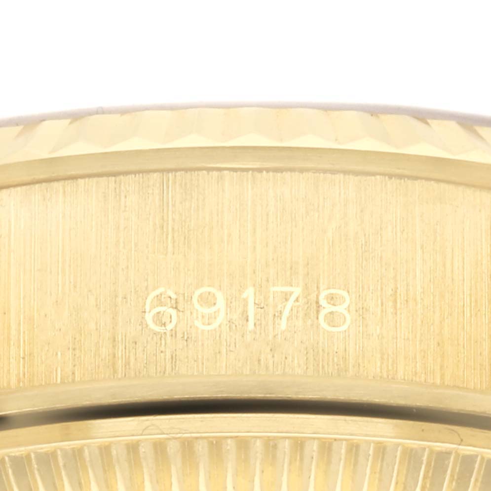 The image shows a close-up of the side case and bezel of a Rolex President 69178 Women's Yellow Gold Champagne Dial 69178 Women's Yellow Gold Champagne Dial model, highlighting the engraved model number 69178.
