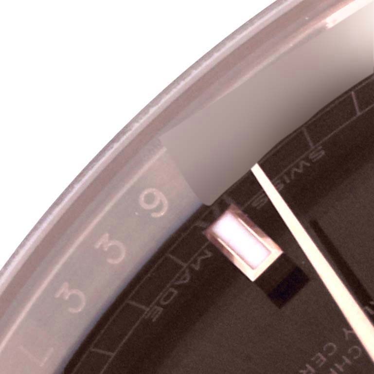 The image shows a close-up of the dial and bezel of a Rolex President 118135 Men
s Rose Gold Brown Dial 118135 Men
s Rose Gold Brown Dial watch.