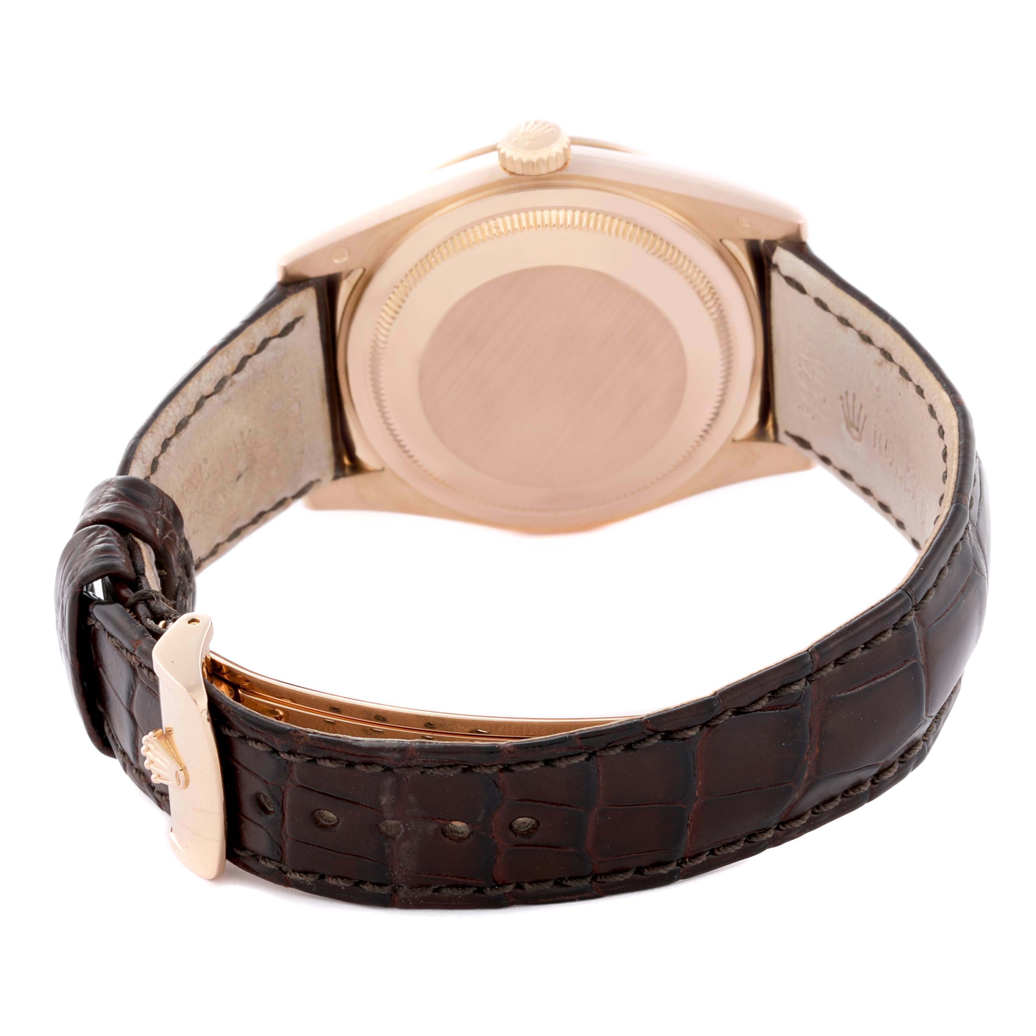 The image shows the back case and leather strap of a Rolex President 118135 Men
s Rose Gold Brown Dial 118135 Men
s Rose Gold Brown Dial model, viewed from the rear angle.