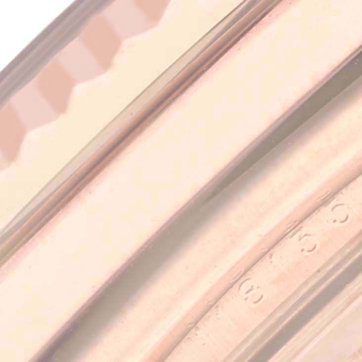 The image shows a close-up of the bracelet links of the Rolex President 118135 Men
s Rose Gold Brown Dial 118135 Men
s Rose Gold Brown Dial watch, highlighting the details.