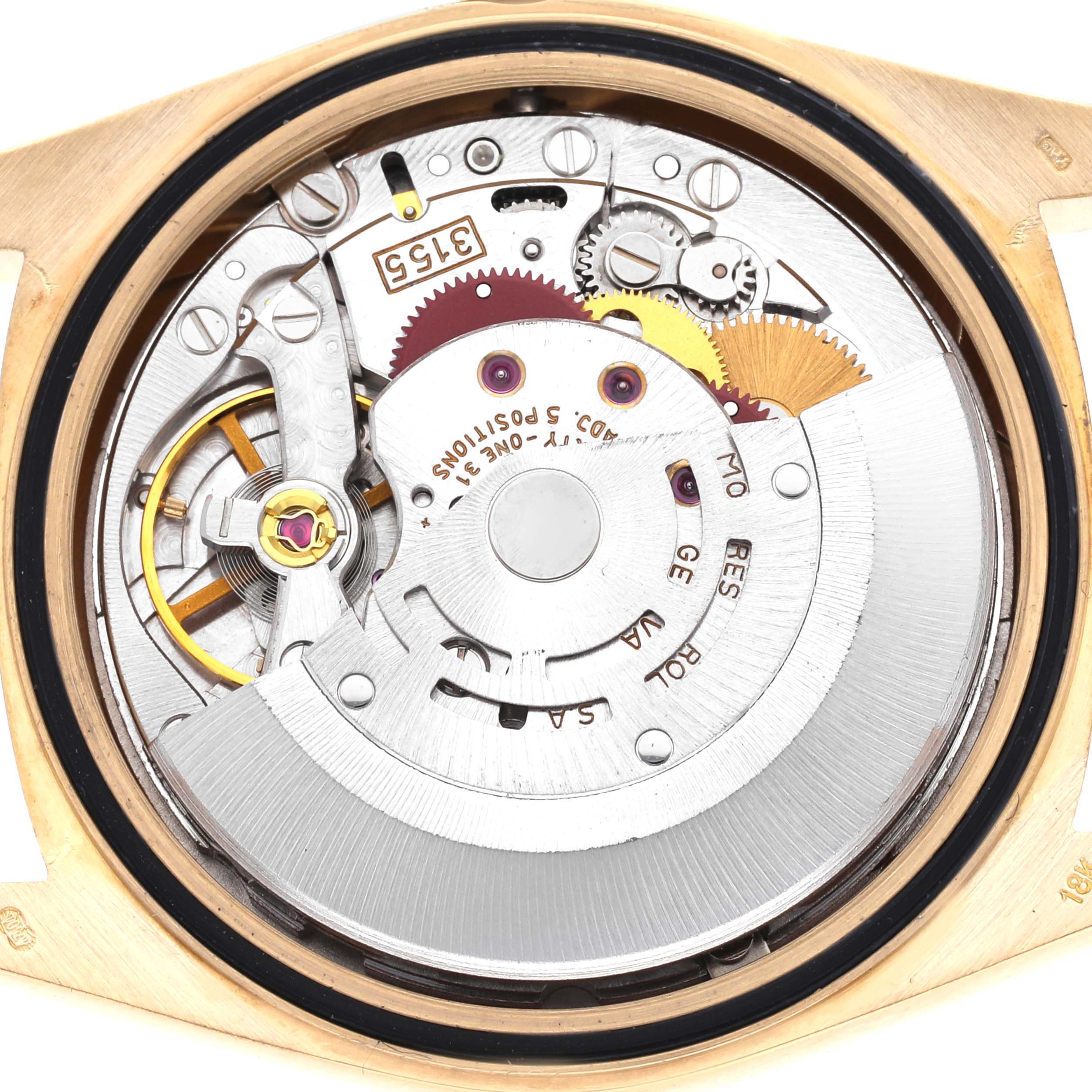 The image shows a close-up of the Rolex President 18238 Men's Yellow Gold Champagne Dial 18238 Men's Yellow Gold Champagne Dial model watch movement from the back, revealing its intricate gears and components.