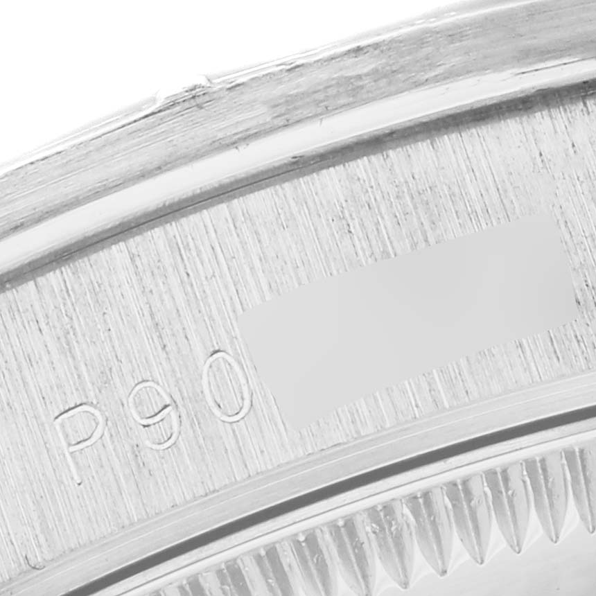 The image shows a close-up of the edge and inner engraving of a Rolex President 78266 Women's Platinum Mother of Pearl Dial 78266 Women's Platinum Mother of Pearl Dial model watch case.