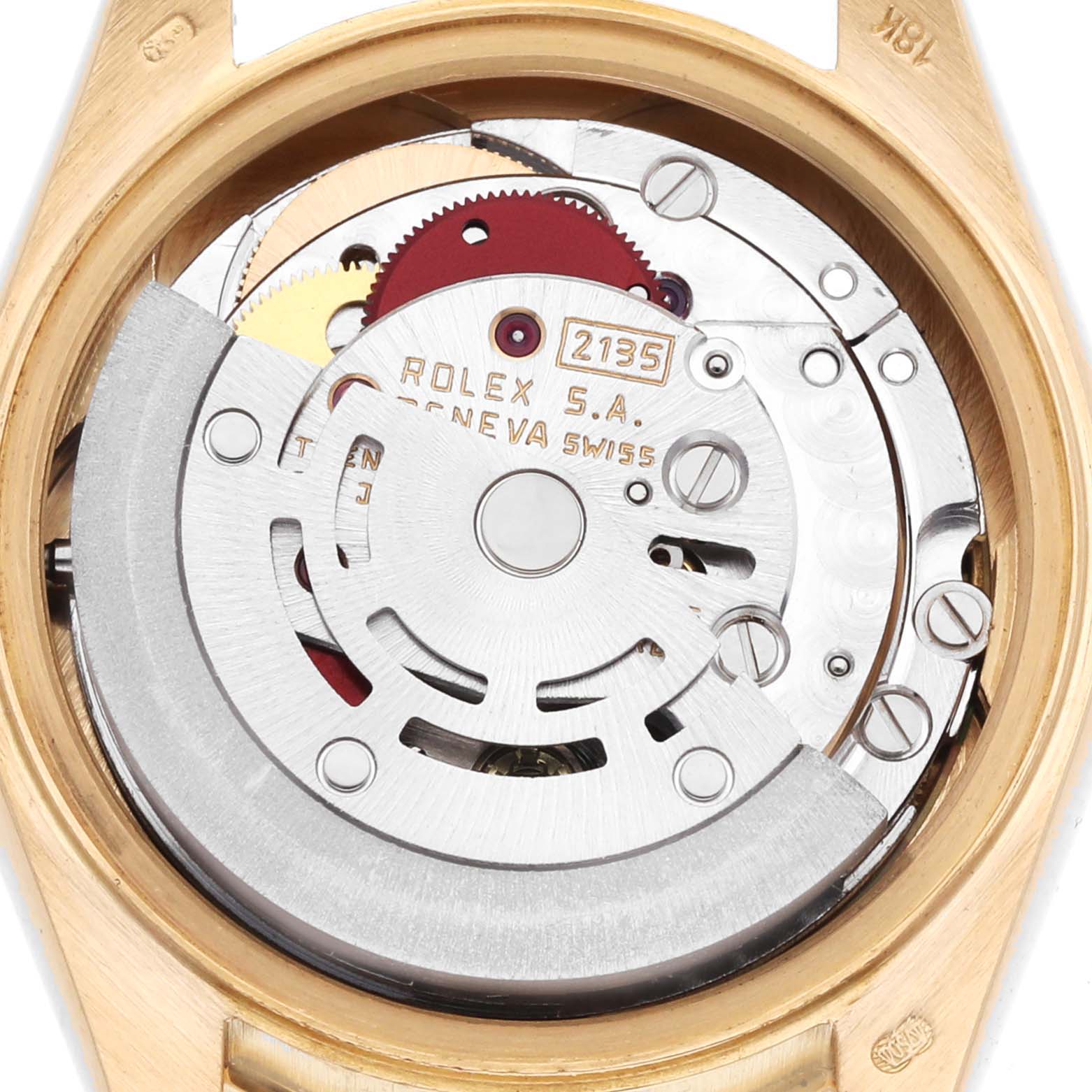 The image shows the movement of a Rolex President 69198 Women
s Yellow Gold Champagne Dial model watch from a rear angle, highlighting its internal mechanical parts.