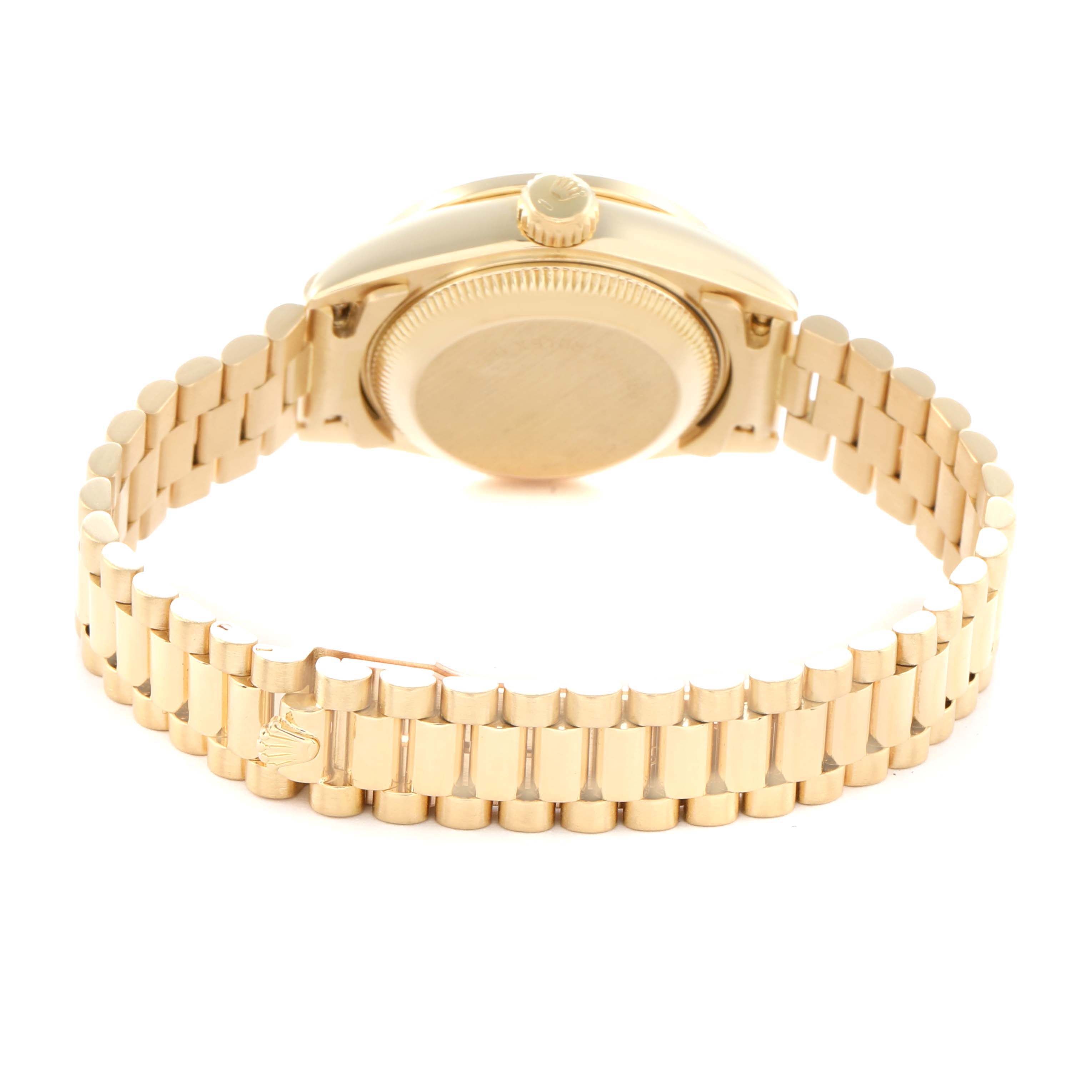 The Rolex President 69198 Women
s Yellow Gold Champagne Dial model is shown from the back, displaying its case back, crown, and bracelet.