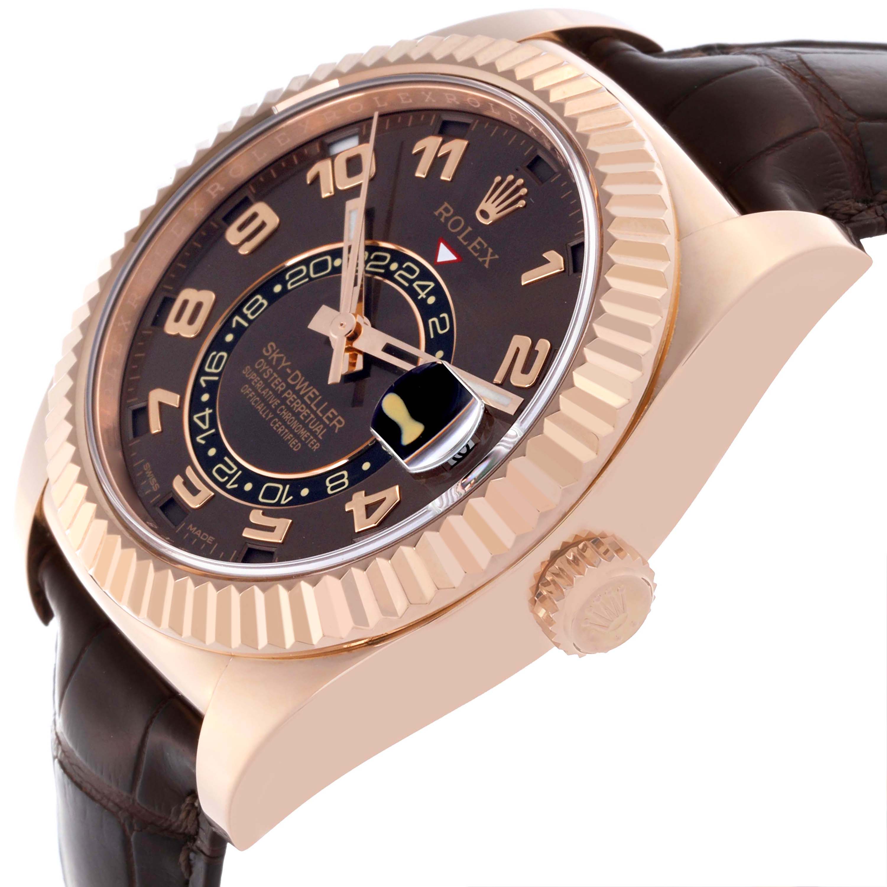 The Rolex Sky-Dweller 326135 Men
s Rose Gold Brown Dial 326135 Men
s Rose Gold Brown Dial watch is shown at an angled view, highlighting the dial, fluted bezel, and crown.