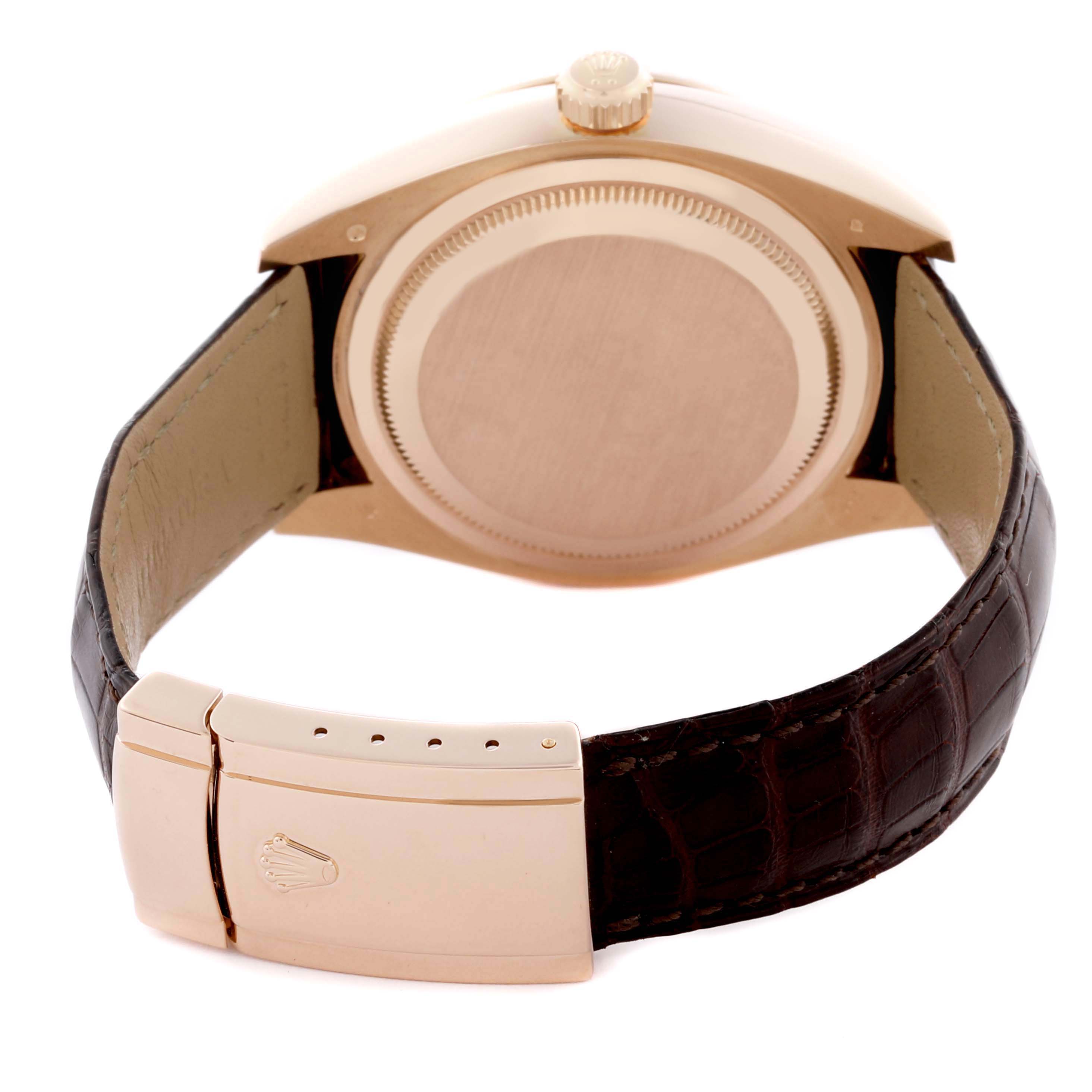 The image shows the back and clasp of the Rolex Sky-Dweller 326135 Men
s Rose Gold Brown Dial 326135 Men
s Rose Gold Brown Dial watch at a rear angle, featuring a leather strap and gold trim.