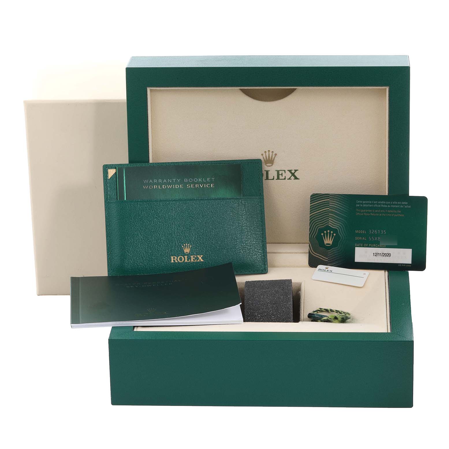 The image shows the packaging, warranty booklet, service card, and bracelet of a Rolex Sky-Dweller 326135 Men
s Rose Gold Brown Dial 326135 Men
s Rose Gold Brown Dial watch.