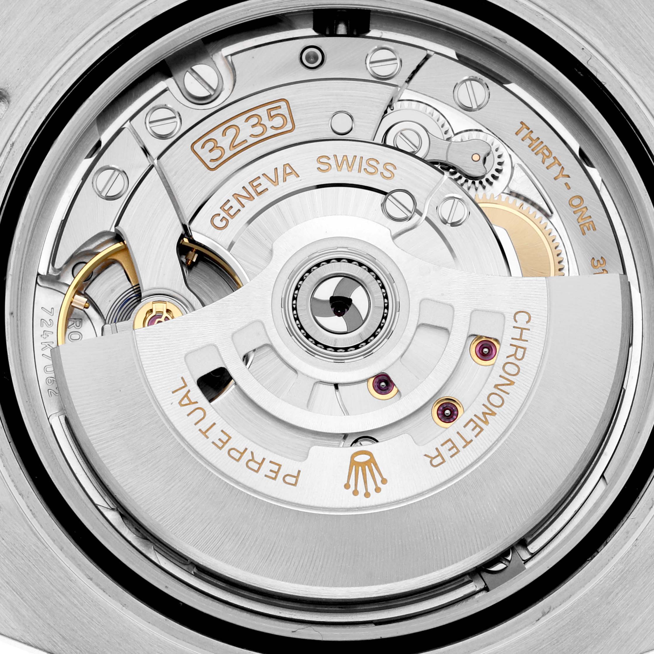 The image shows the Rolex Submariner 126613 Men's Steel and Gold (two tone) Blue Dial 126613 Men's Steel and Gold (two tone) Blue Dial's intricate mechanical movement from a top-down angle, highlighting the rotor and inner mechanisms.