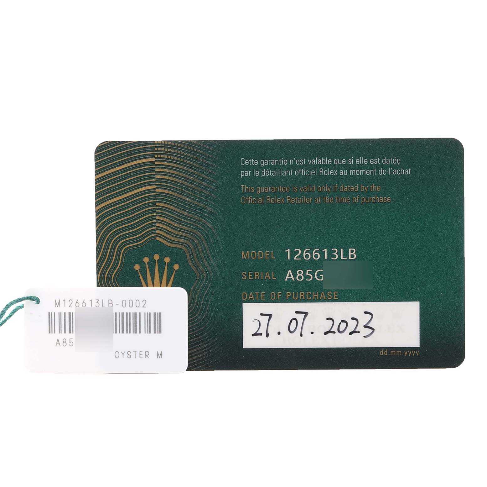 The image shows a warranty card and tag for a Rolex Submariner 126613 Men's Steel and Gold (two tone) Blue Dial 126613 Men's Steel and Gold (two tone) Blue Dial 126613LB.