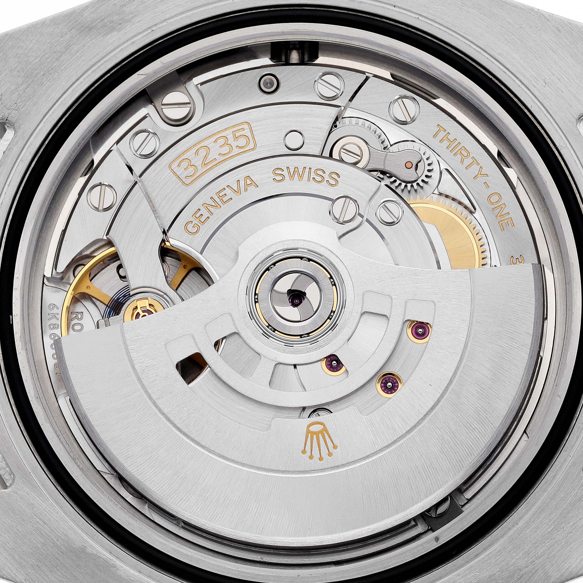 The image shows the movement of a Rolex Submariner 126613LN Men's Steel and Gold (two tone) Black Dial 126613LN Men's Steel and Gold (two tone) Black Dial, featuring the detailed inner mechanism.