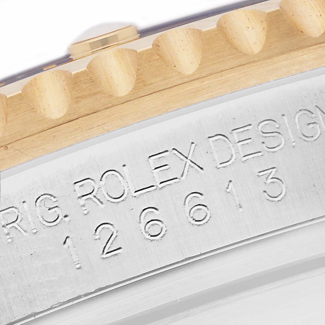 The image shows a close-up of the bezel and engraved model number of a Rolex Submariner 126613LN Men's Steel and Gold (two tone) Black Dial 126613LN Men's Steel and Gold (two tone) Black Dial watch.