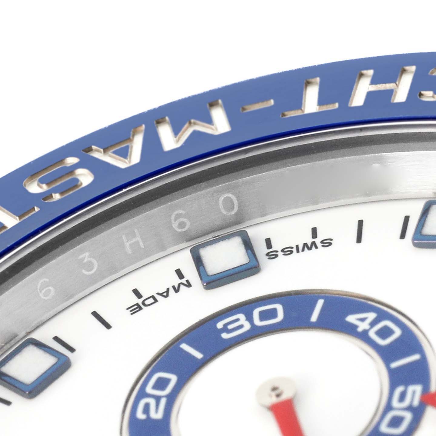 The image shows a close-up of the Rolex Yacht-Master 116680 Men's Stainless Steel White Dial 116680 Men's Stainless Steel White Dial's bezel and part of the dial.