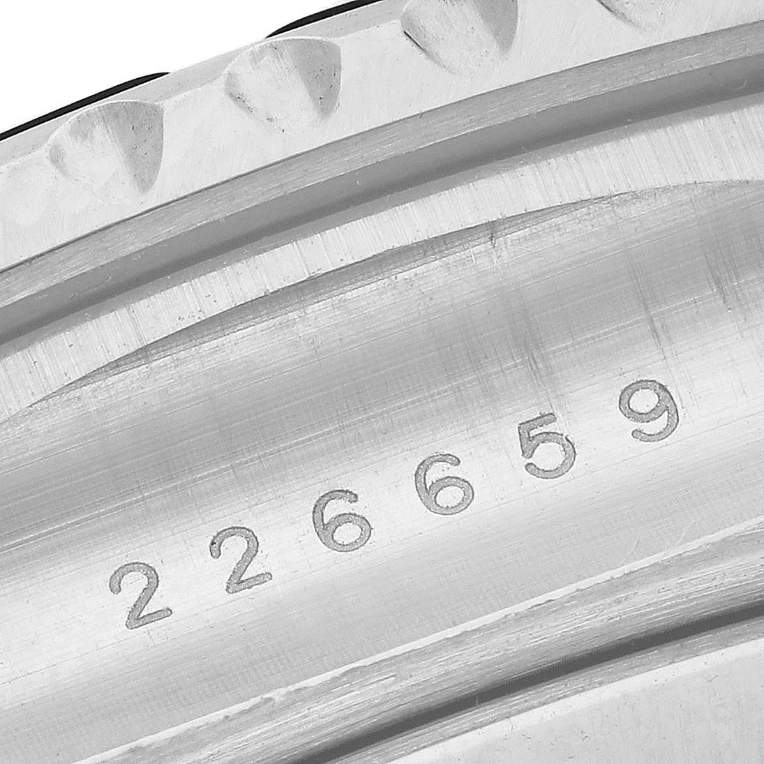 The image shows a close-up of the bezel and serial number on the Rolex Yacht-Master 226659 Men's White Gold Black Dial 226659 Men's White Gold Black Dial watch.