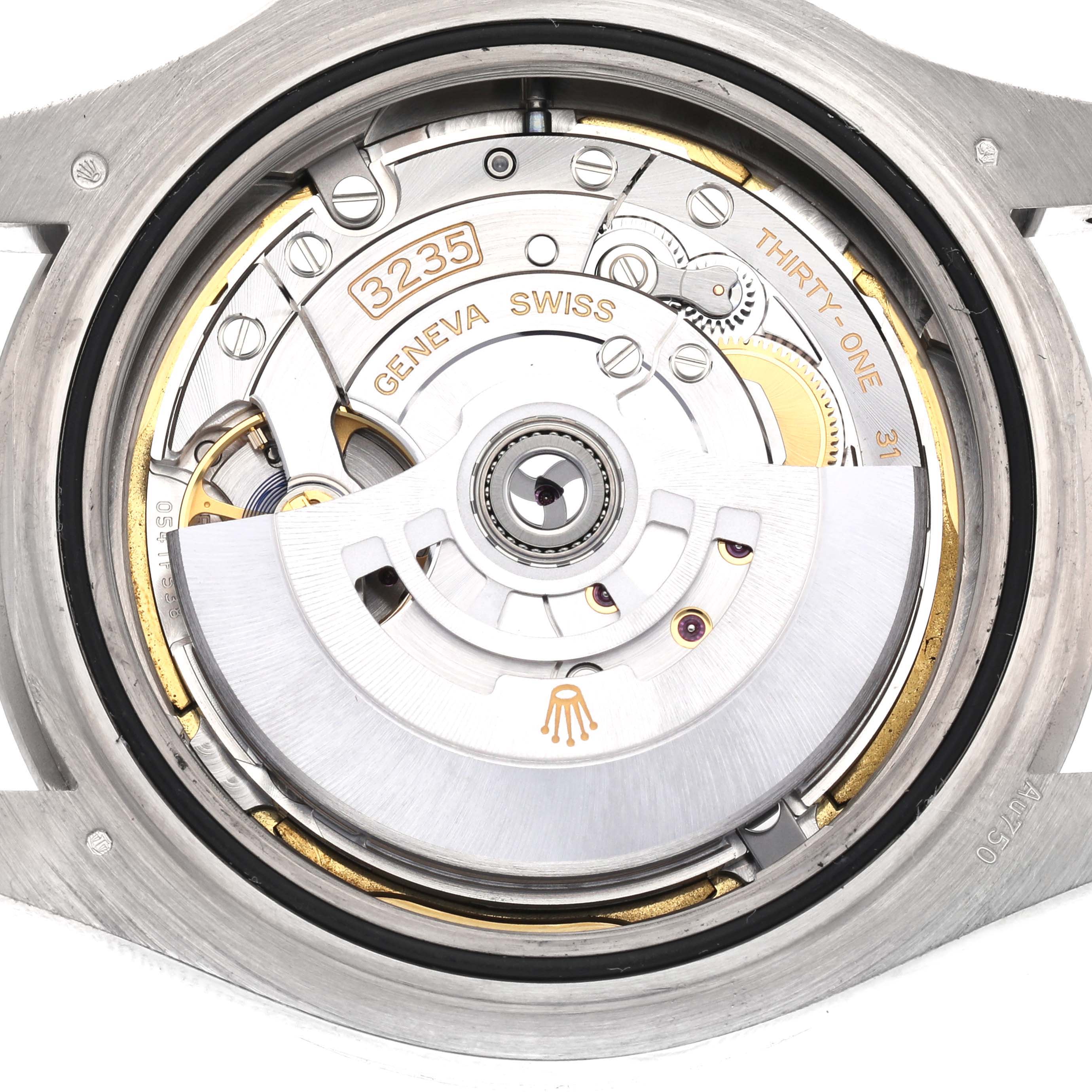 The image shows a close-up of the movement mechanism of a Rolex Yacht-Master 226659 Men's White Gold Black Dial, showcasing the intricate parts inside the case.