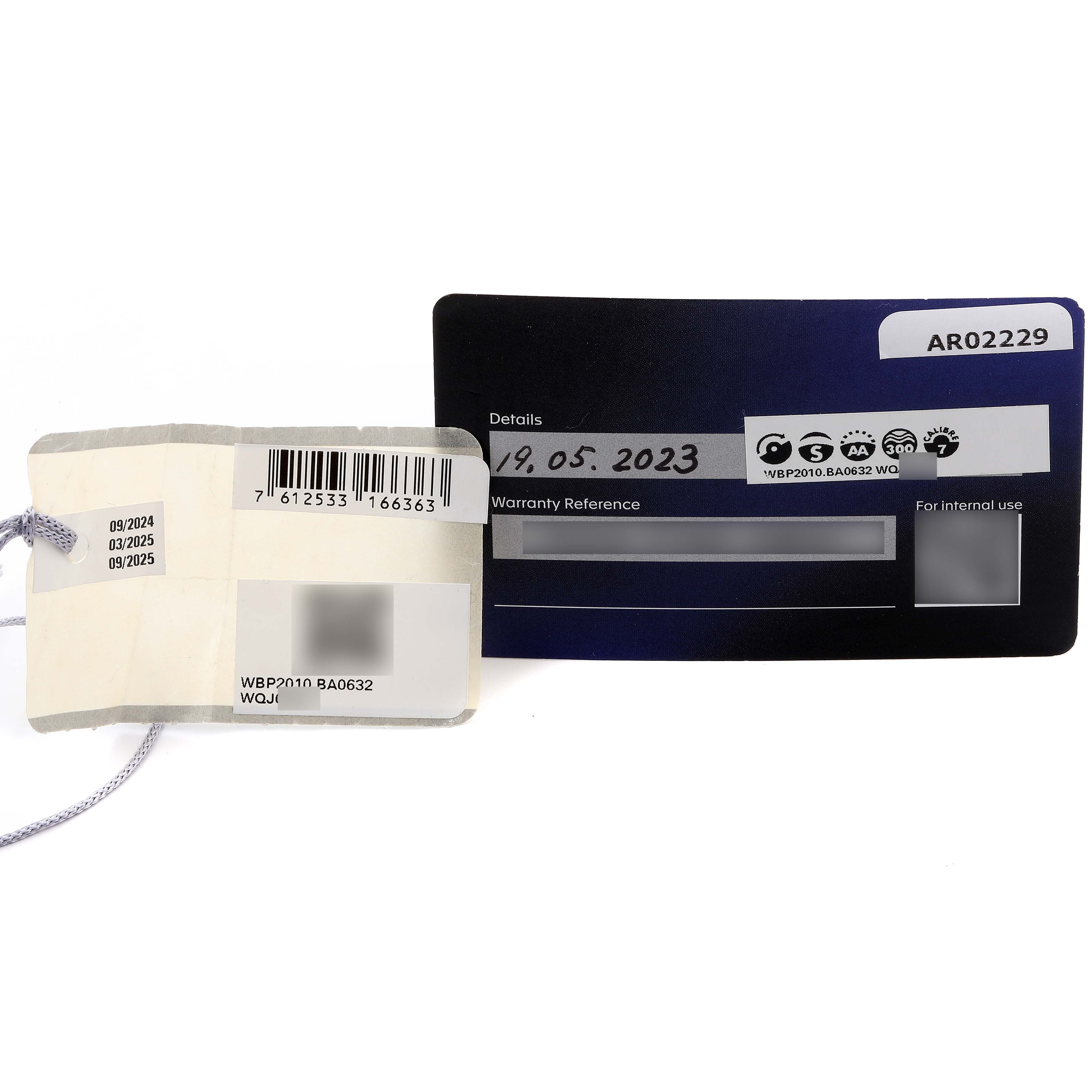 The image shows the warranty card and tag for the Tag Heuer Aquaracer WBP2010 Men
s Stainless Steel Blue Dial WBP2010 Men
s Stainless Steel Blue Dial model.