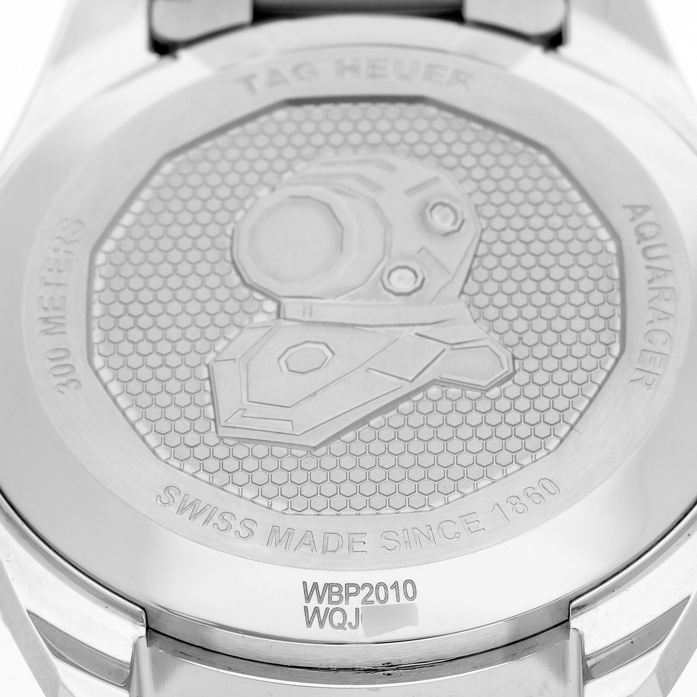 This image shows the back case of the Tag Heuer Aquaracer WBP2010 Men
s Stainless Steel Blue Dial WBP2010 Men
s Stainless Steel Blue Dial watch, highlighting its engravings and logo.