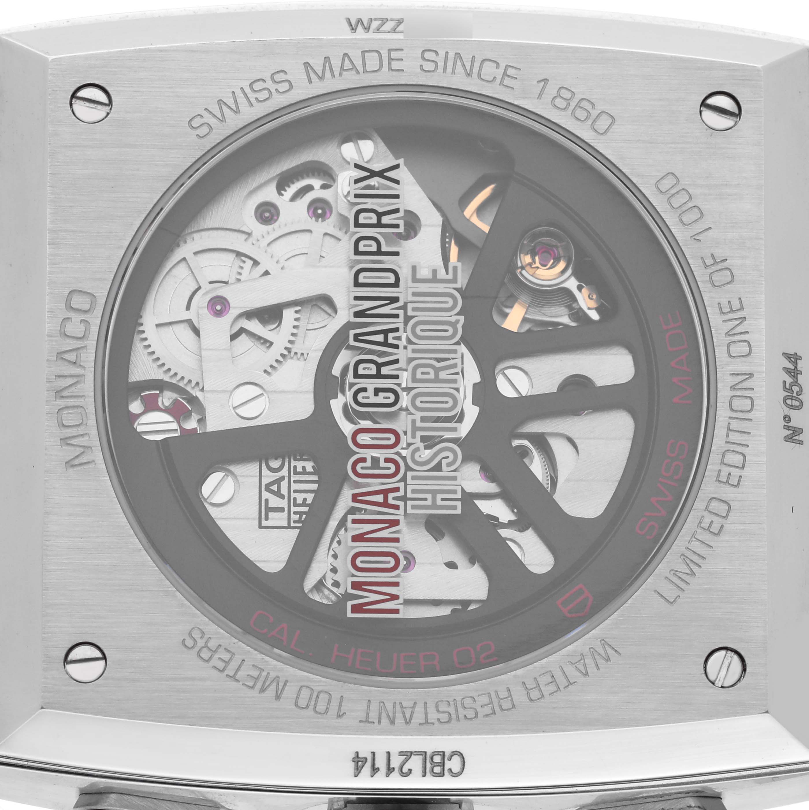 The image shows the back of the Tag Heuer Monaco CBL2114.FC6486 Men's Stainless Steel Red Dial CBL2114.FC6486 Men's Stainless Steel Red Dial watch, displaying its automatic movement and engraved details.