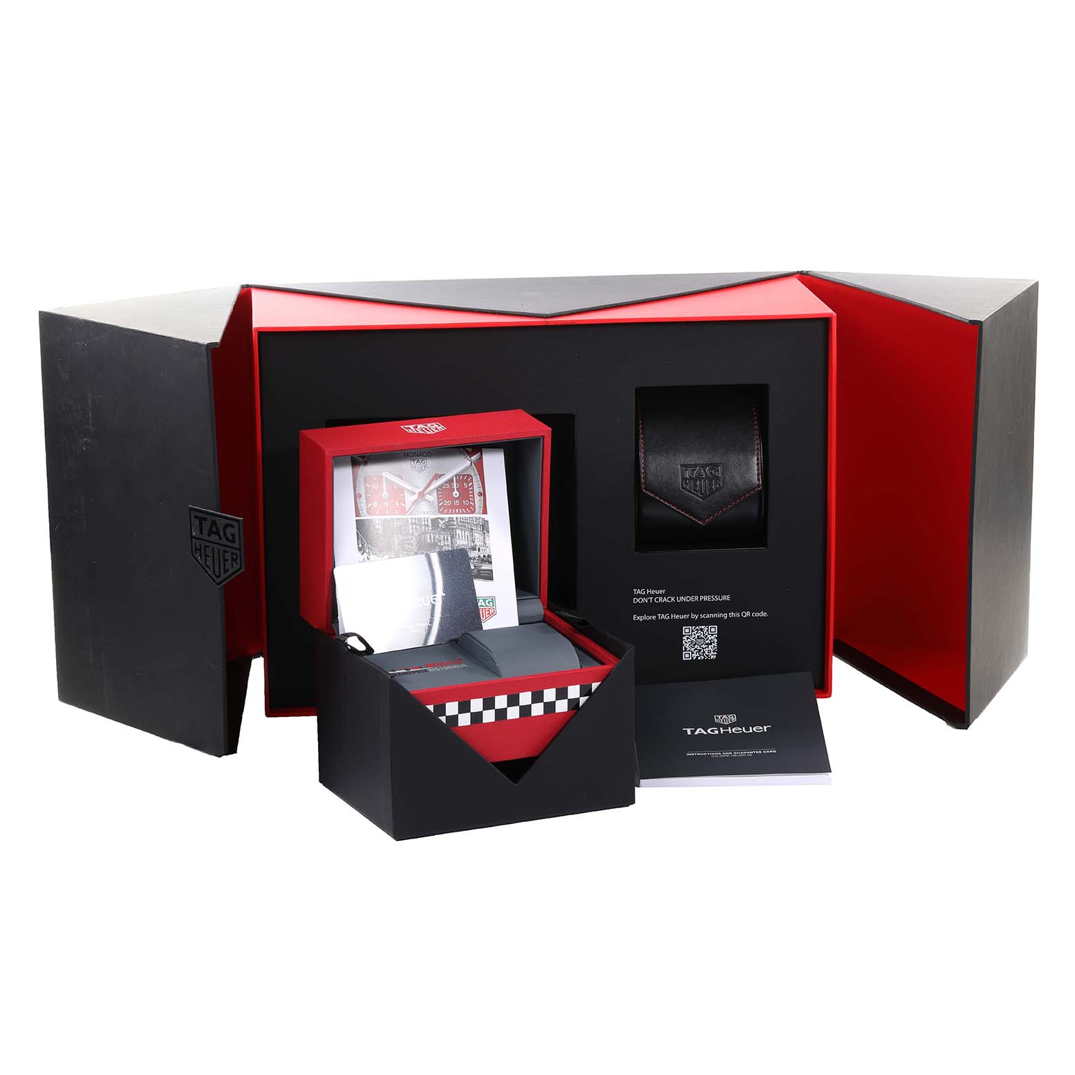 The image shows the packaging and accessories of the Tag Heuer Monaco CBL2114.FC6486 Men's Stainless Steel Red Dial CBL2114.FC6486 Men's Stainless Steel Red Dial watch, including a box, booklet, and case.