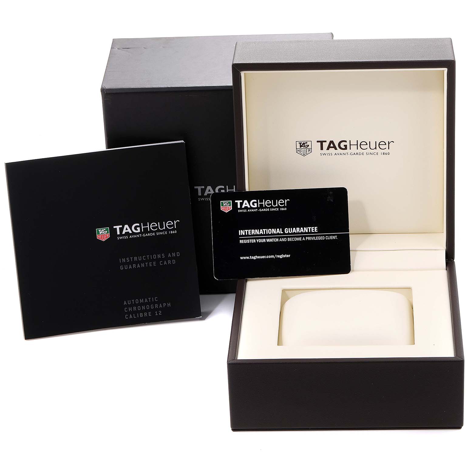 This image shows the packaging, international guarantee card, and instruction manual of a Tag Heuer Monaco CAW2111 Men's Stainless Steel Blue Dial CAW2111 Men's Stainless Steel Blue Dial watch.