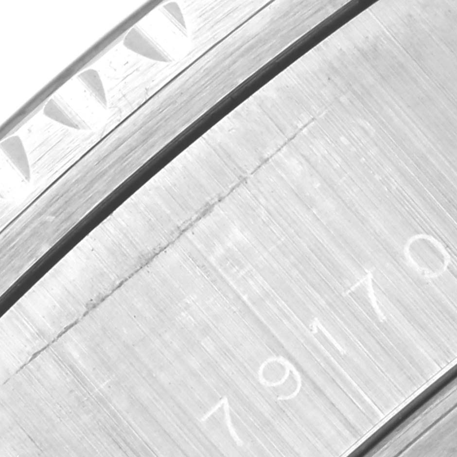 The image shows a close-up of the bezel and side case with engravings of the Tudor Big Block 79170 Men's Stainless Steel Black Dial 79170 Men's Stainless Steel Black Dial watch.