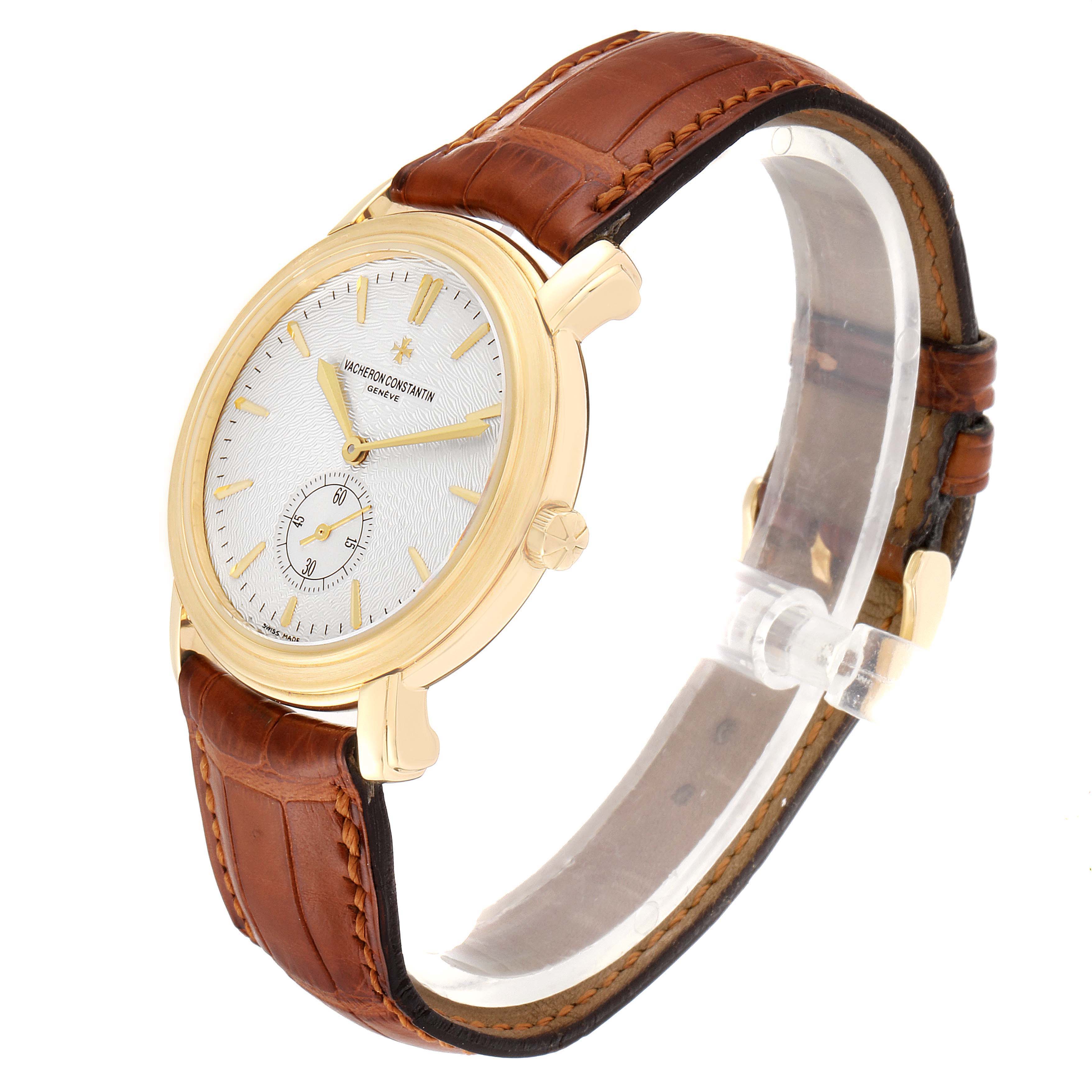 This image shows a side angle of the Vacheron Constantin Malte 81000 Men's Yellow Gold Silver Dial 81000 Men's Yellow Gold Silver Dial watch, highlighting the gold case, white dial, and brown leather strap.