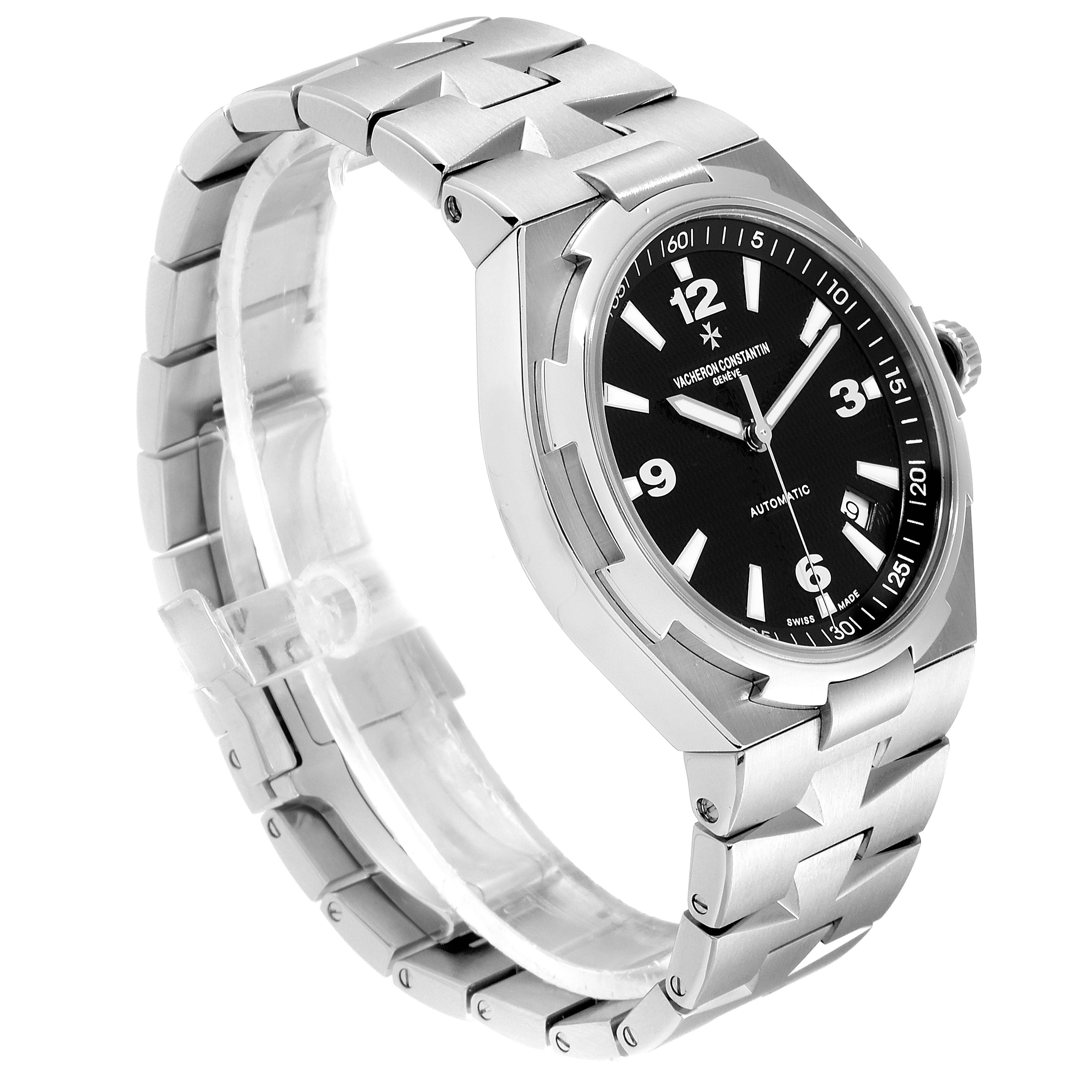 The image shows a Vacheron Constantin Overseas 47040/B01A-9094 Men's Stainless Steel Black Dial 47040/B01A-9094 Men's Stainless Steel Black Dial watch from a three-quarter angle highlighting the face, bracelet, and side profile.