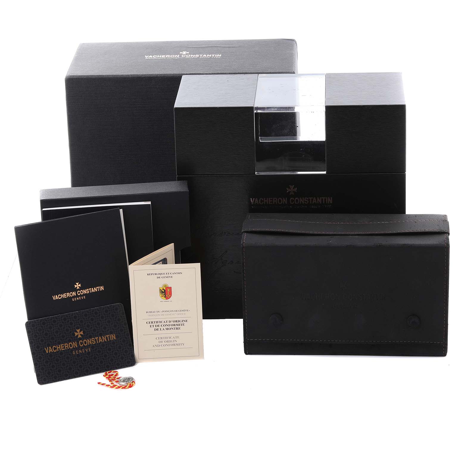 The image shows the packaging and documents for the Vacheron Constantin Patrimony 4100U/000R-B643 Men's Rose Gold Blue Dial 4100U/000R-B643 Men's Rose Gold Blue Dial watch, including boxes, certificates, and a pouch.