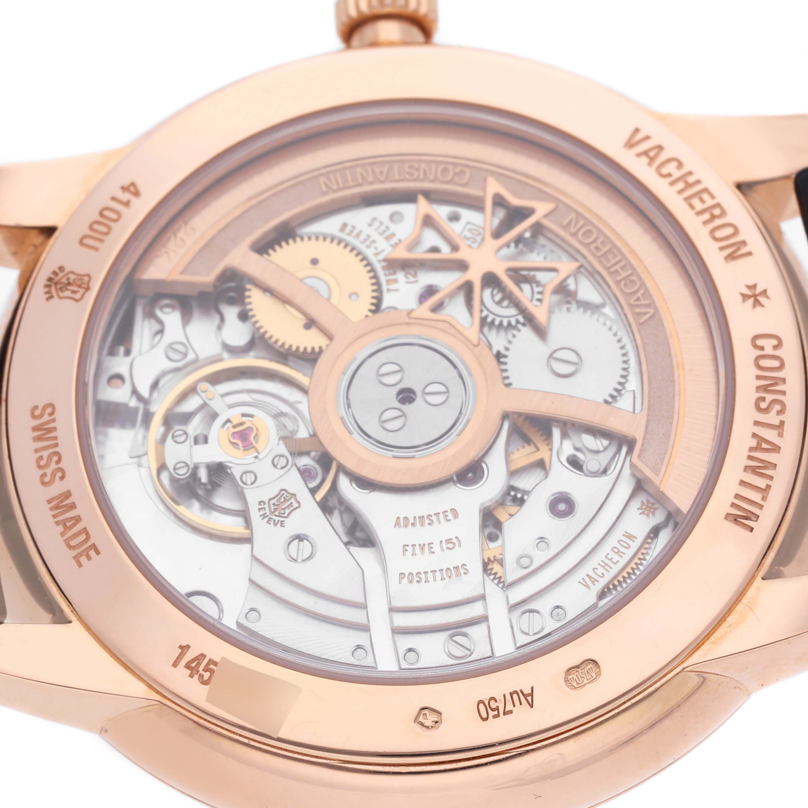 The image shows the back view of the Vacheron Constantin Patrimony 4100U/000R-B643 Men's Rose Gold Blue Dial 4100U/000R-B643 Men's Rose Gold Blue Dial watch, highlighting its intricate movement and engraving details.