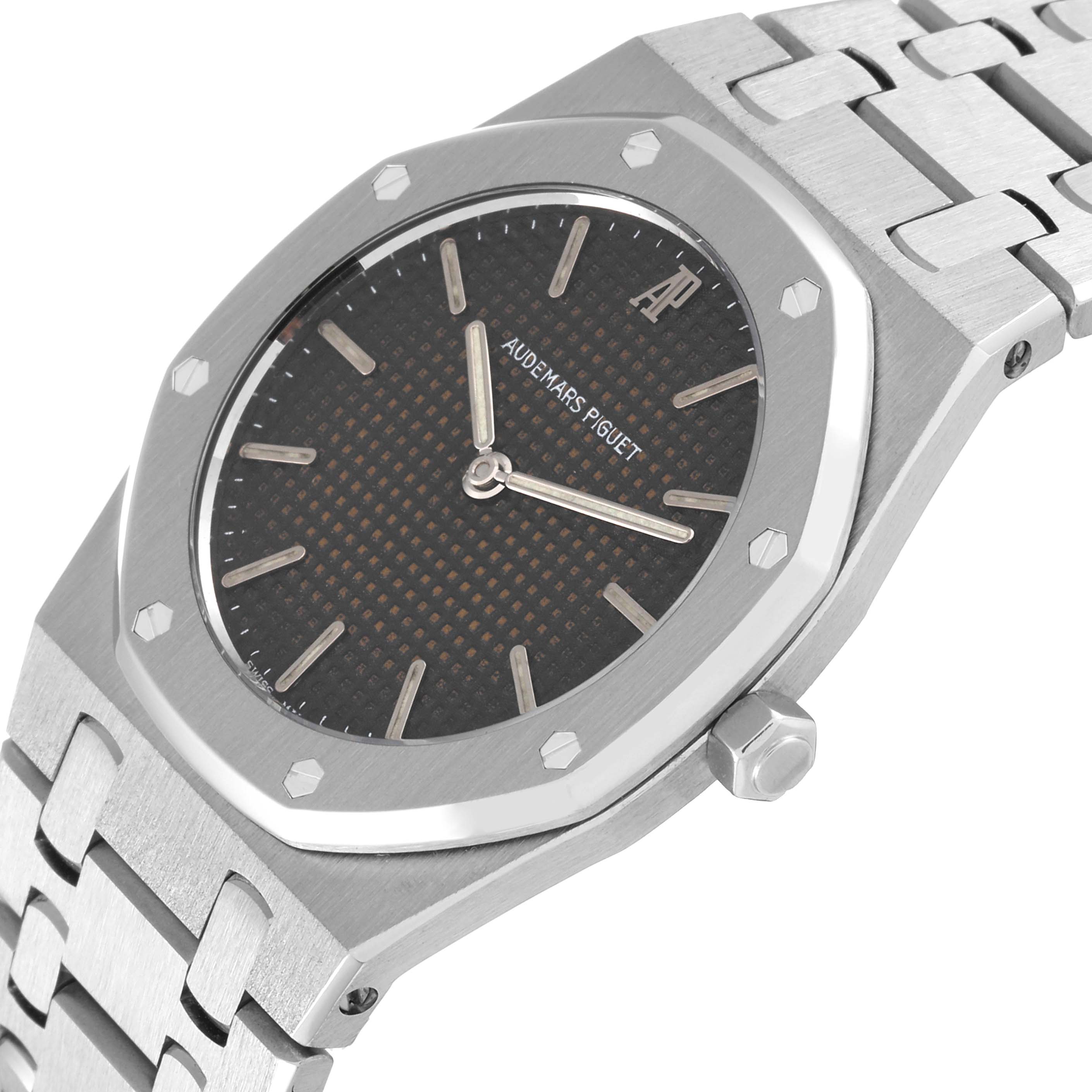 The image shows a close-up angle of the dial, case, and bracelet of the Audemars Piguet Royal Oak 56303ST Men's Stainless Steel Black Dial 56303ST Men's Stainless Steel Black Dial watch.