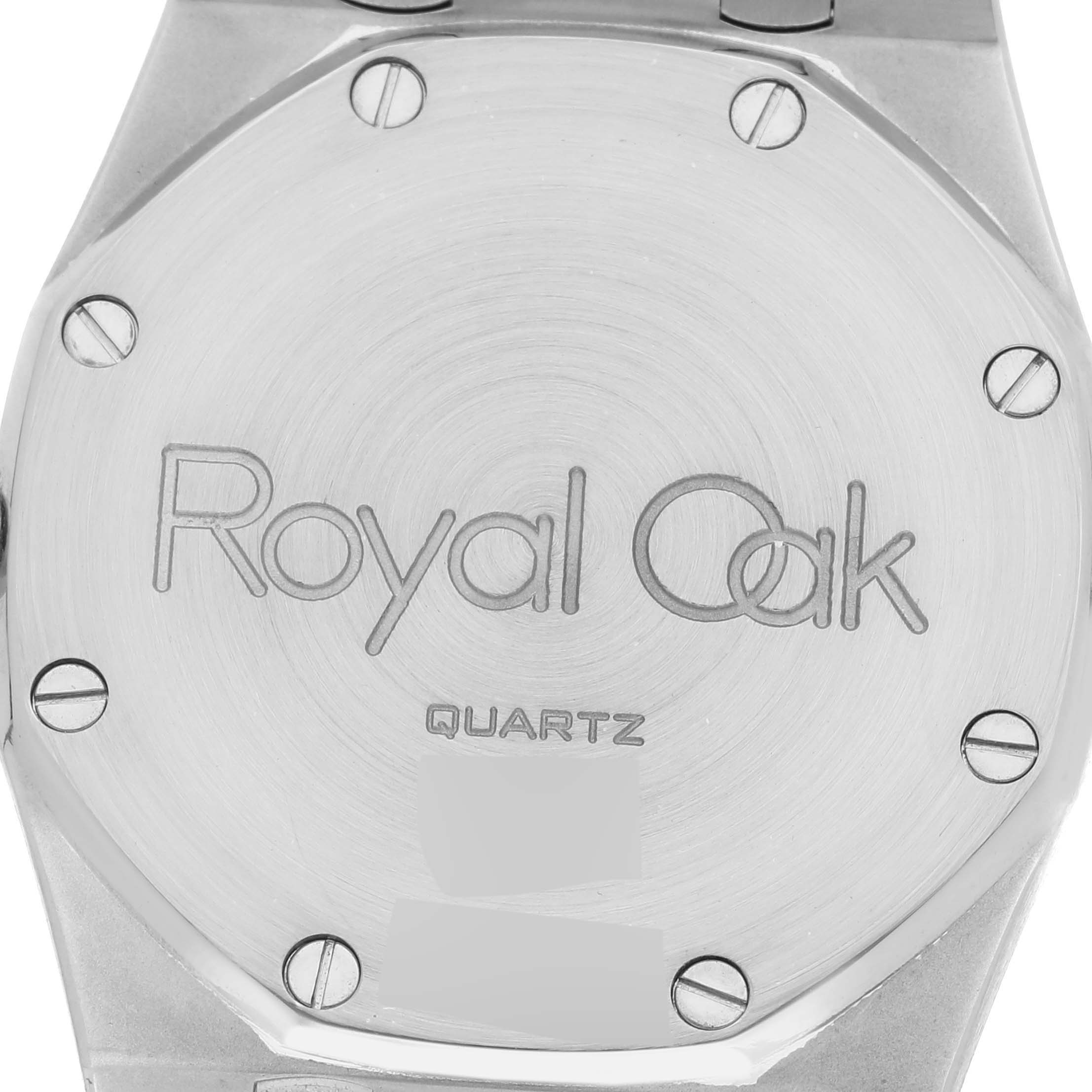 This image shows the back of an Audemars Piguet Royal Oak 56303ST Men's Stainless Steel Black Dial 56303ST Men's Stainless Steel Black Dial watch, highlighting the engraved logo and screws.