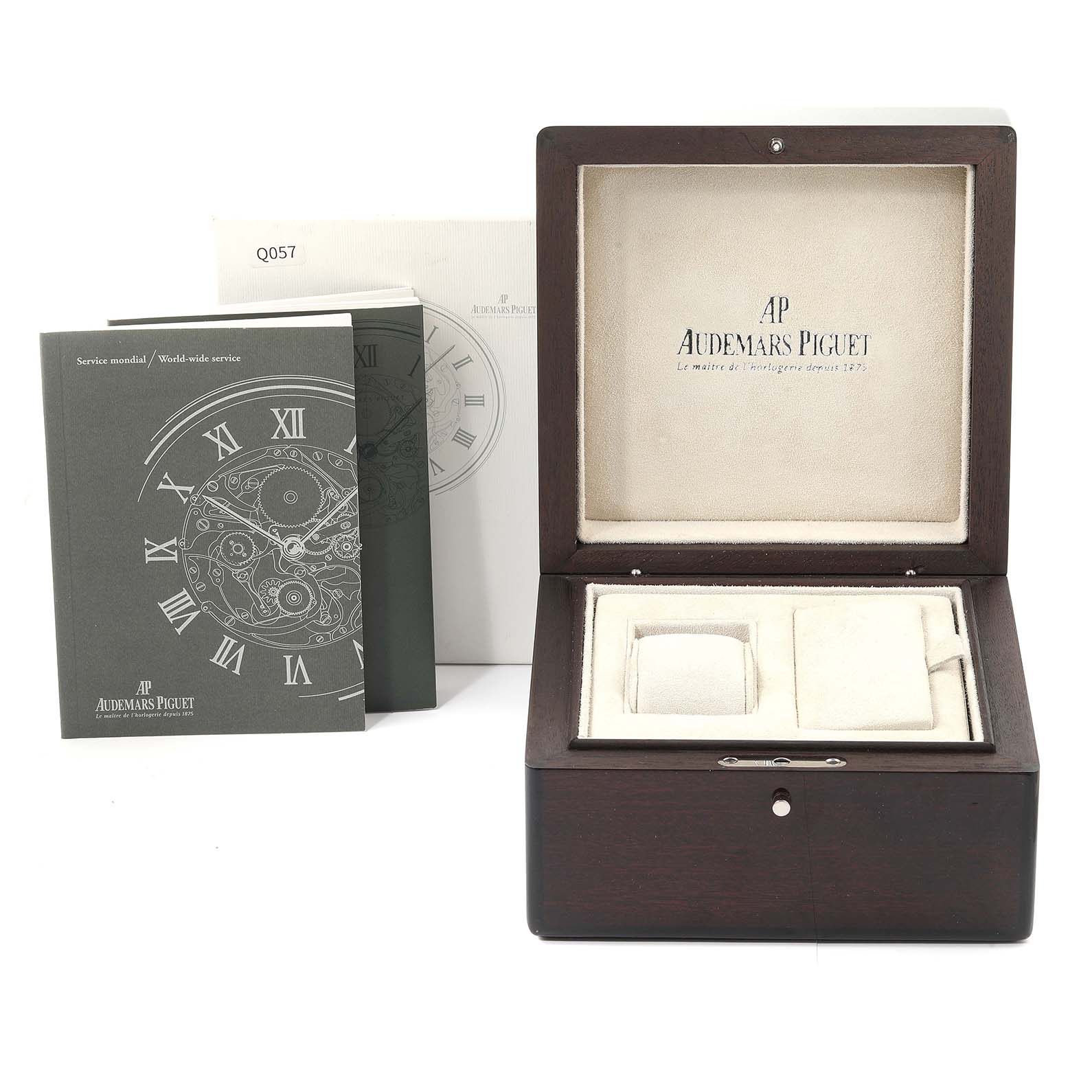 The image shows the box, pamphlets, and accessories for the Royal Oak model by Audemars Piguet.