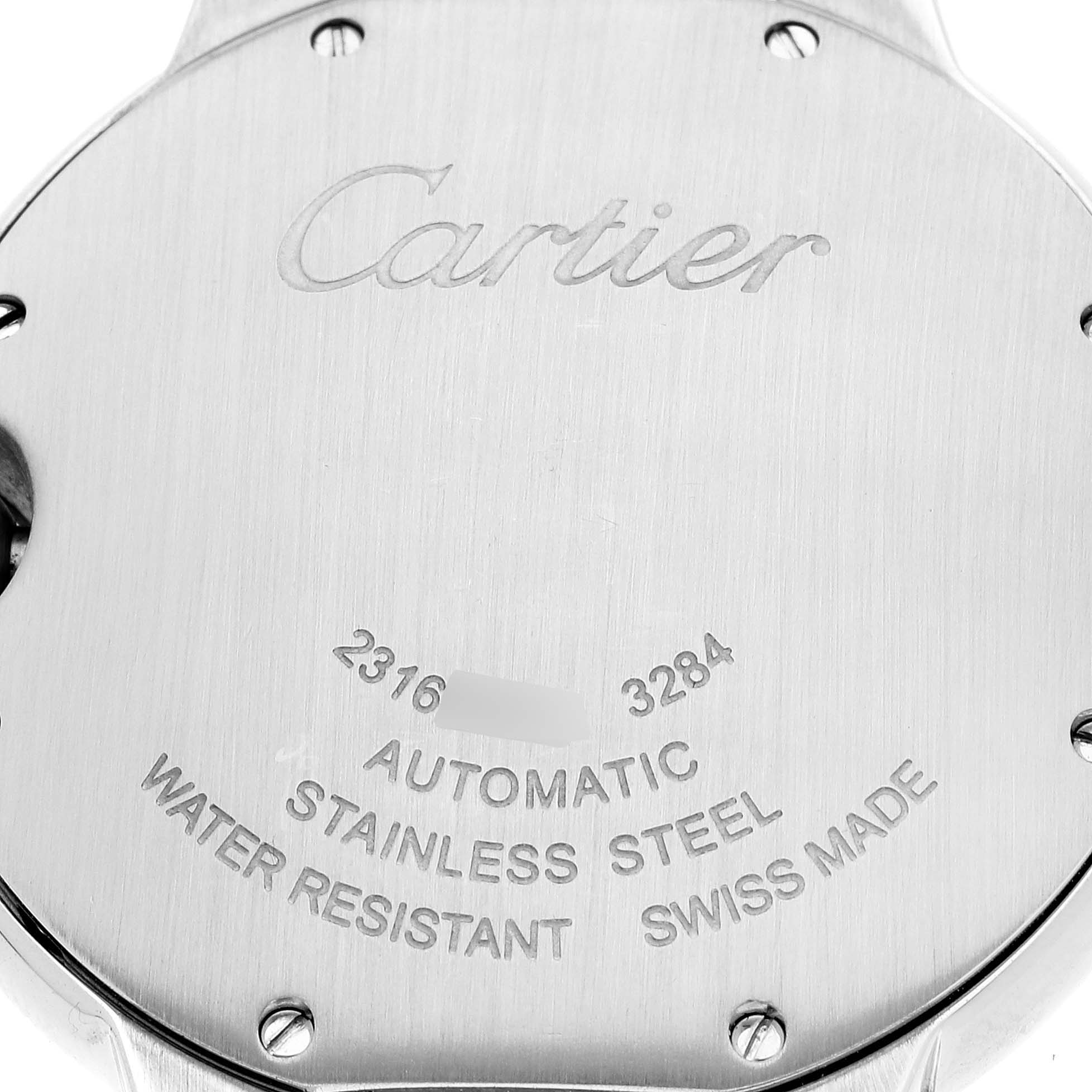 This image shows the back case of a Ballon Bleu model by Cartier, showcasing engravings and detailing like "automatic" and "stainless steel."