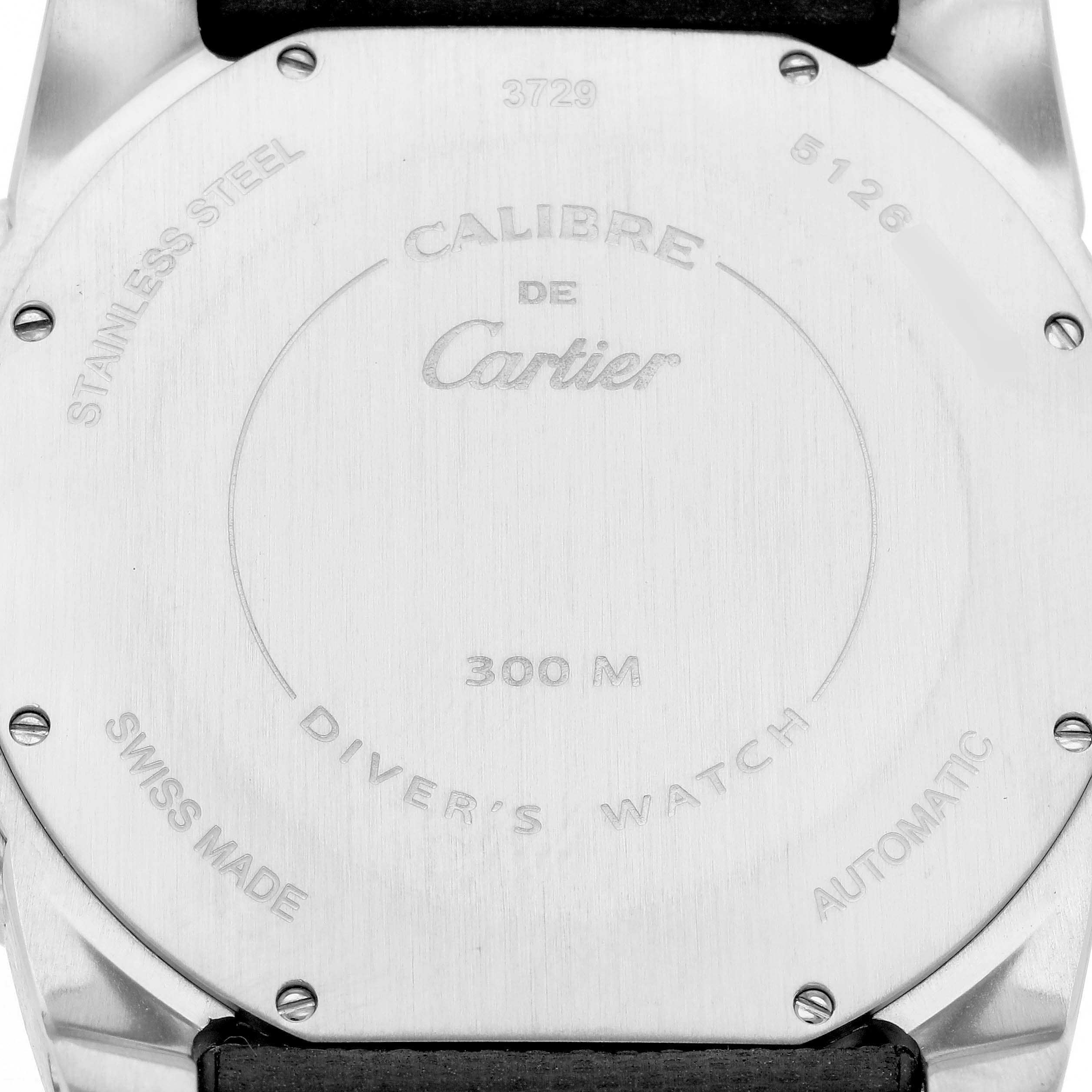 The image shows the back case of a Calibre de Cartier watch by Cartier, displaying engravings and screws.