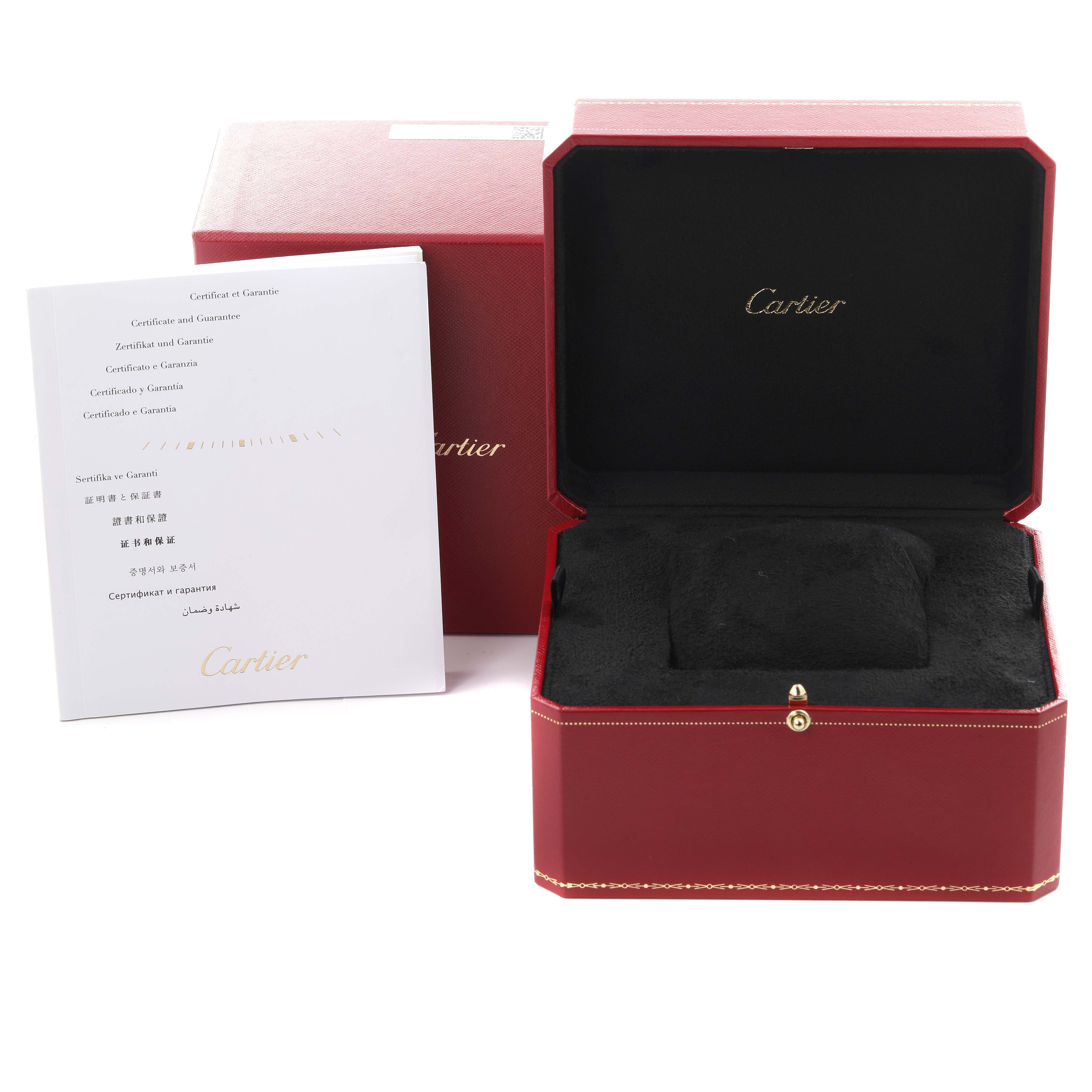 The image shows an open Cartier box for a Calibre de Cartier watch, along with a certificate booklet.