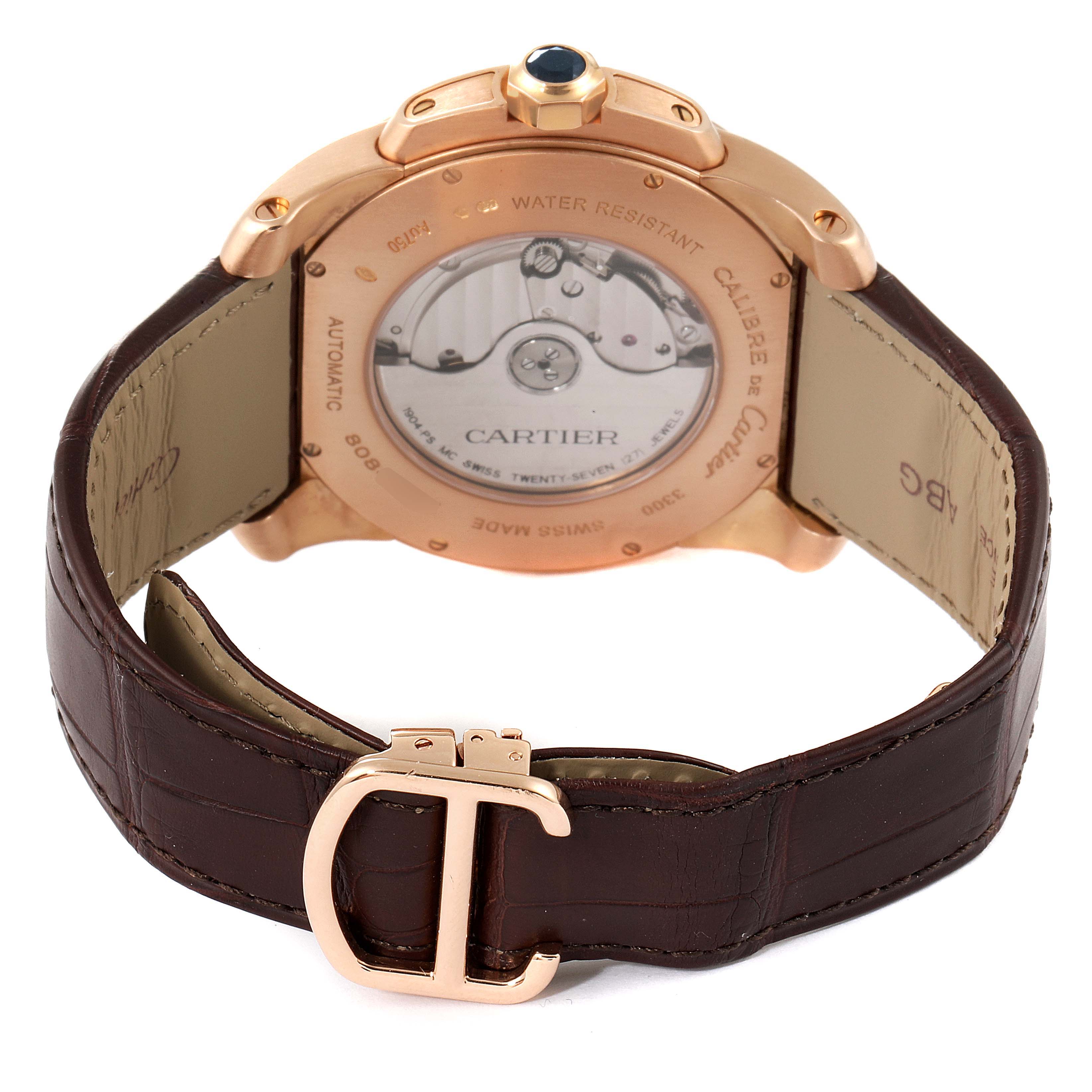 This image shows the back of the Calibre de Cartier watch by Cartier, highlighting the movement and leather strap.