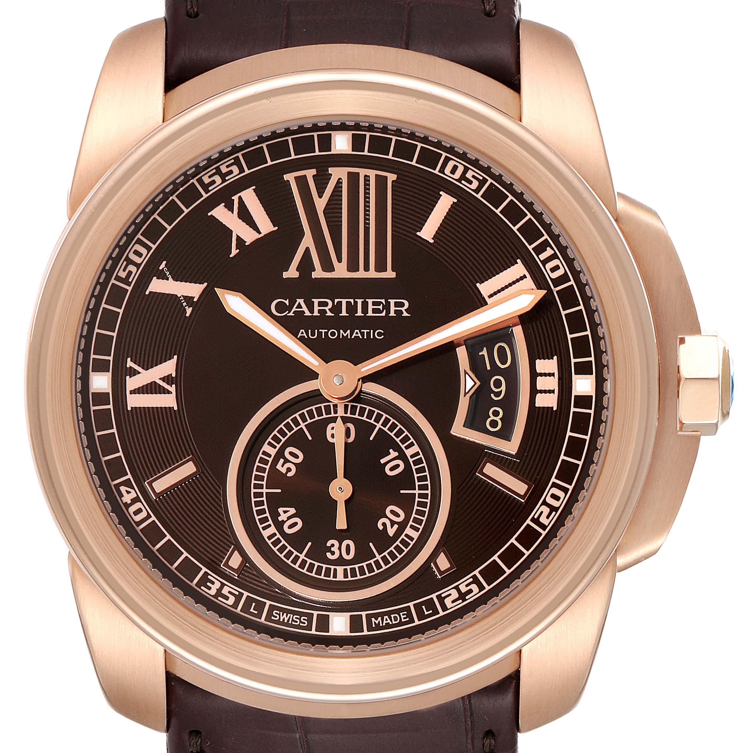 The image shows a frontal view of a Calibre de Cartier watch by Cartier, highlighting its dial, hands, sub-dial, and date window.