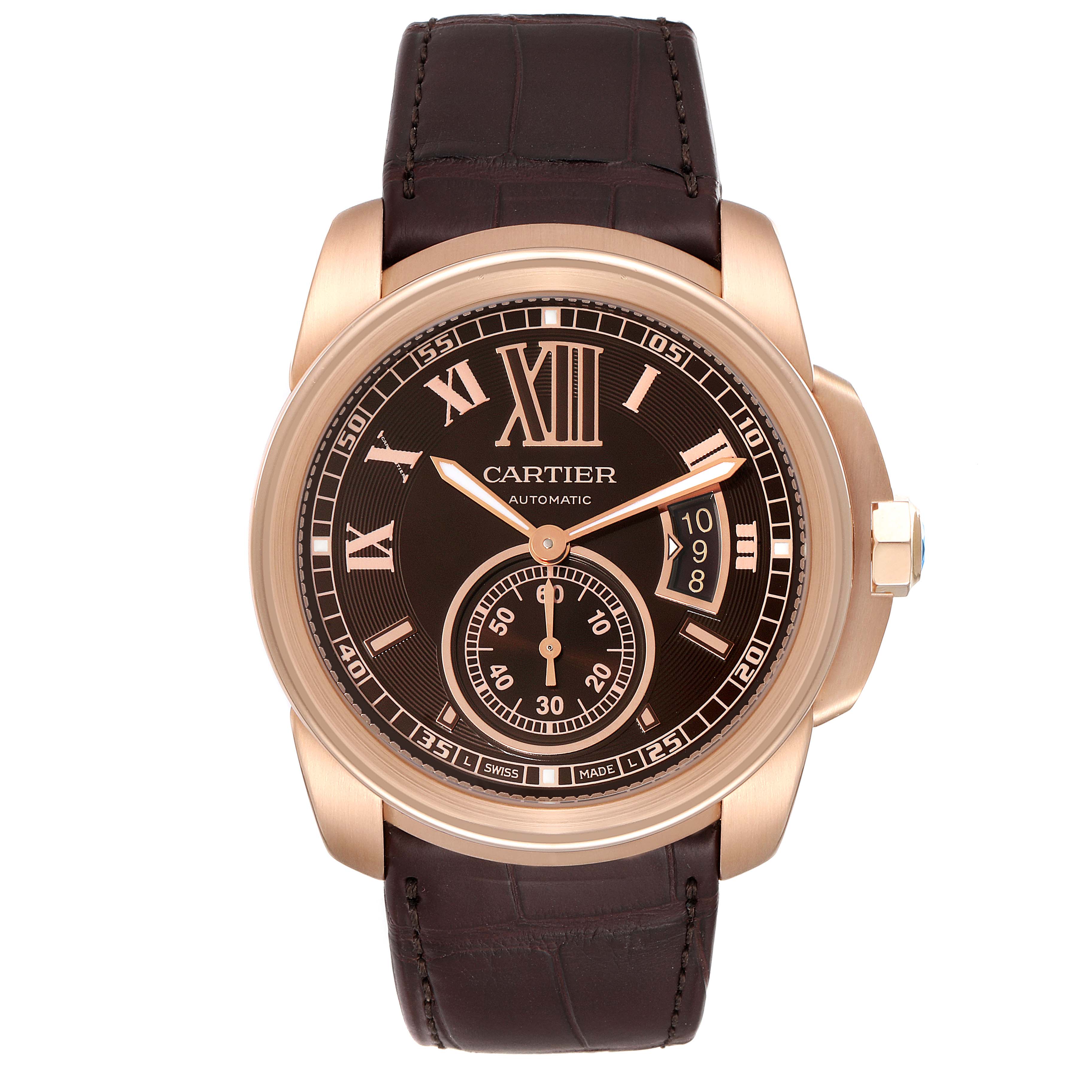 The image shows a front view of a Calibre de Cartier watch by Cartier, featuring a brown dial and leather strap.