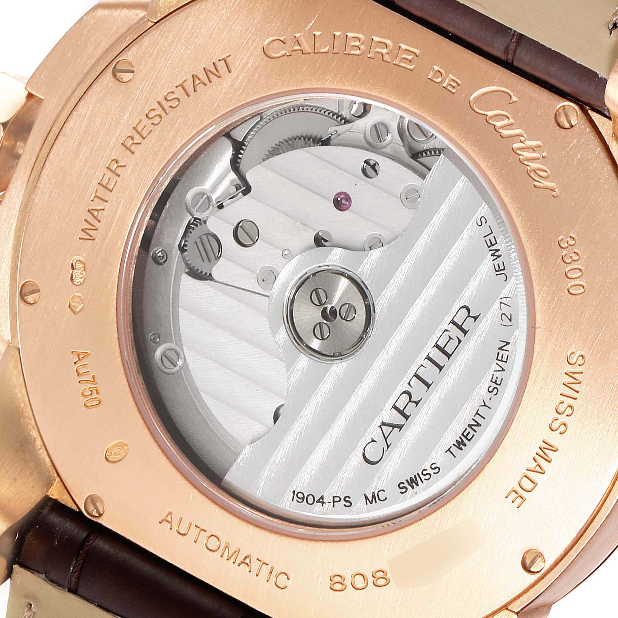 This image shows the back of the Calibre de Cartier watch by Cartier, highlighting its automatic movement and craftsmanship.