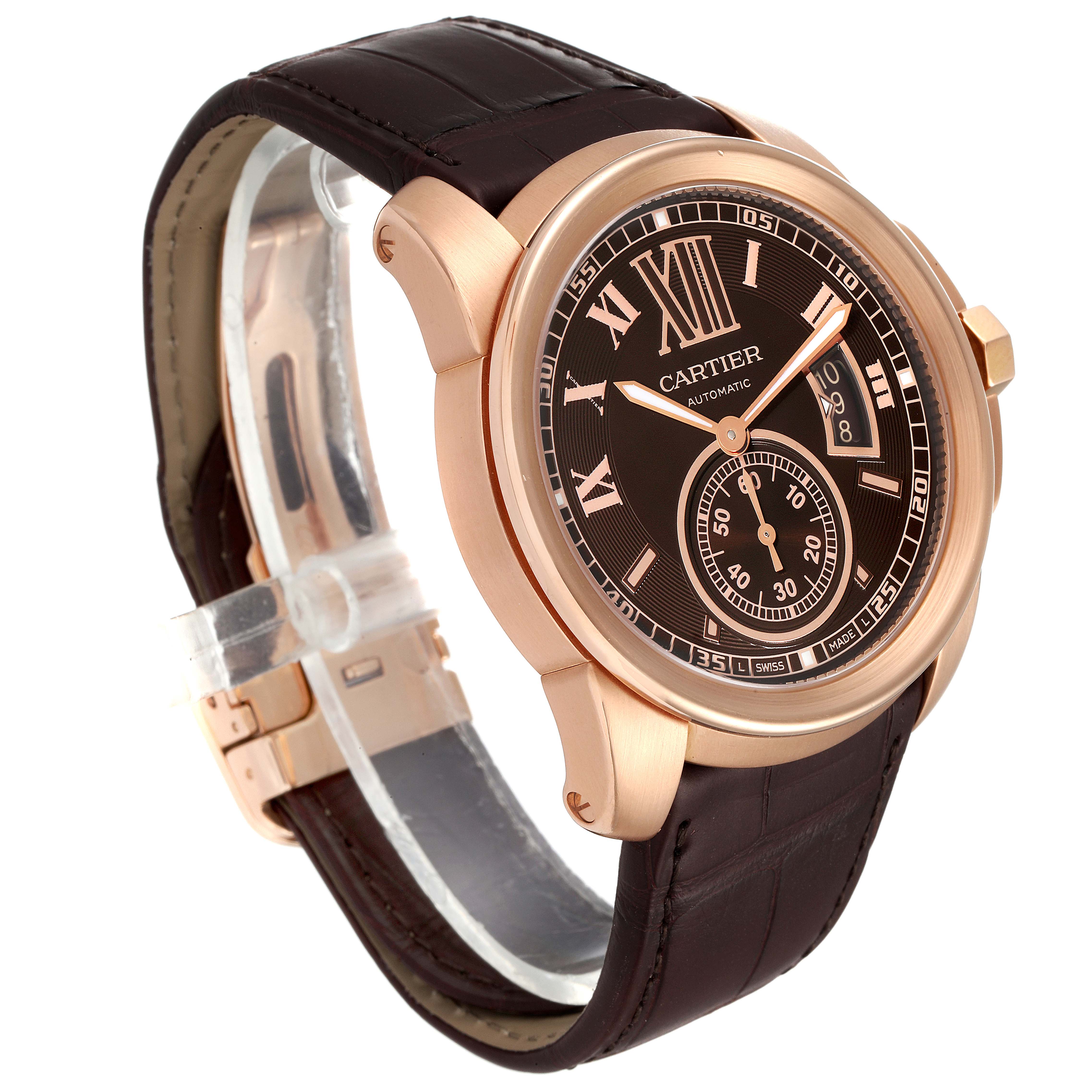 The image shows a Calibre de Cartier watch by Cartier at a 3/4 angle, highlighting the face, case, and leather strap.