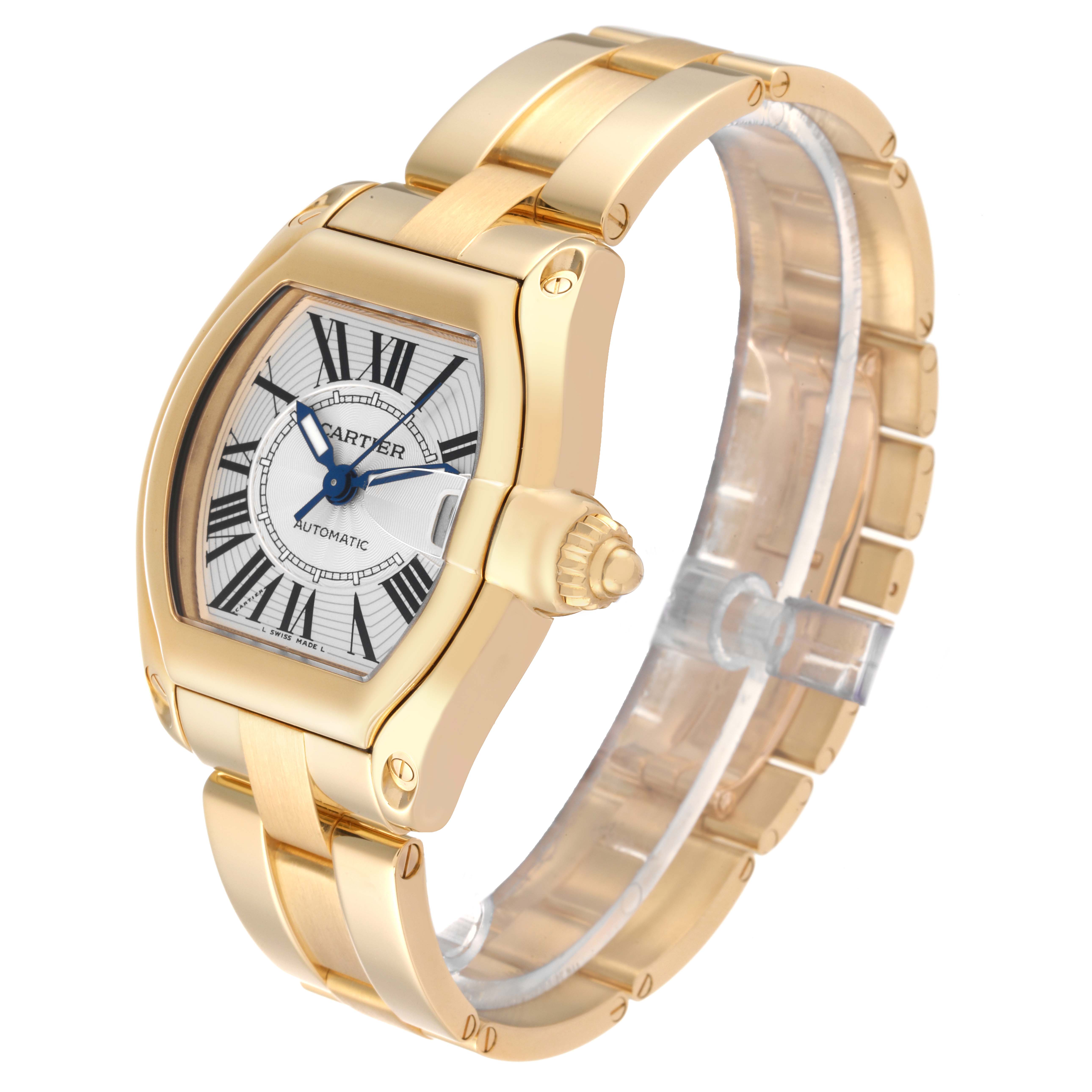 The image shows a gold Cartier Roadster W62005V1 Men's Yellow Gold Silver Dial W62005V1 Men's Yellow Gold Silver Dial watch displaying the face, bezel, and partial bracelet at an angle.